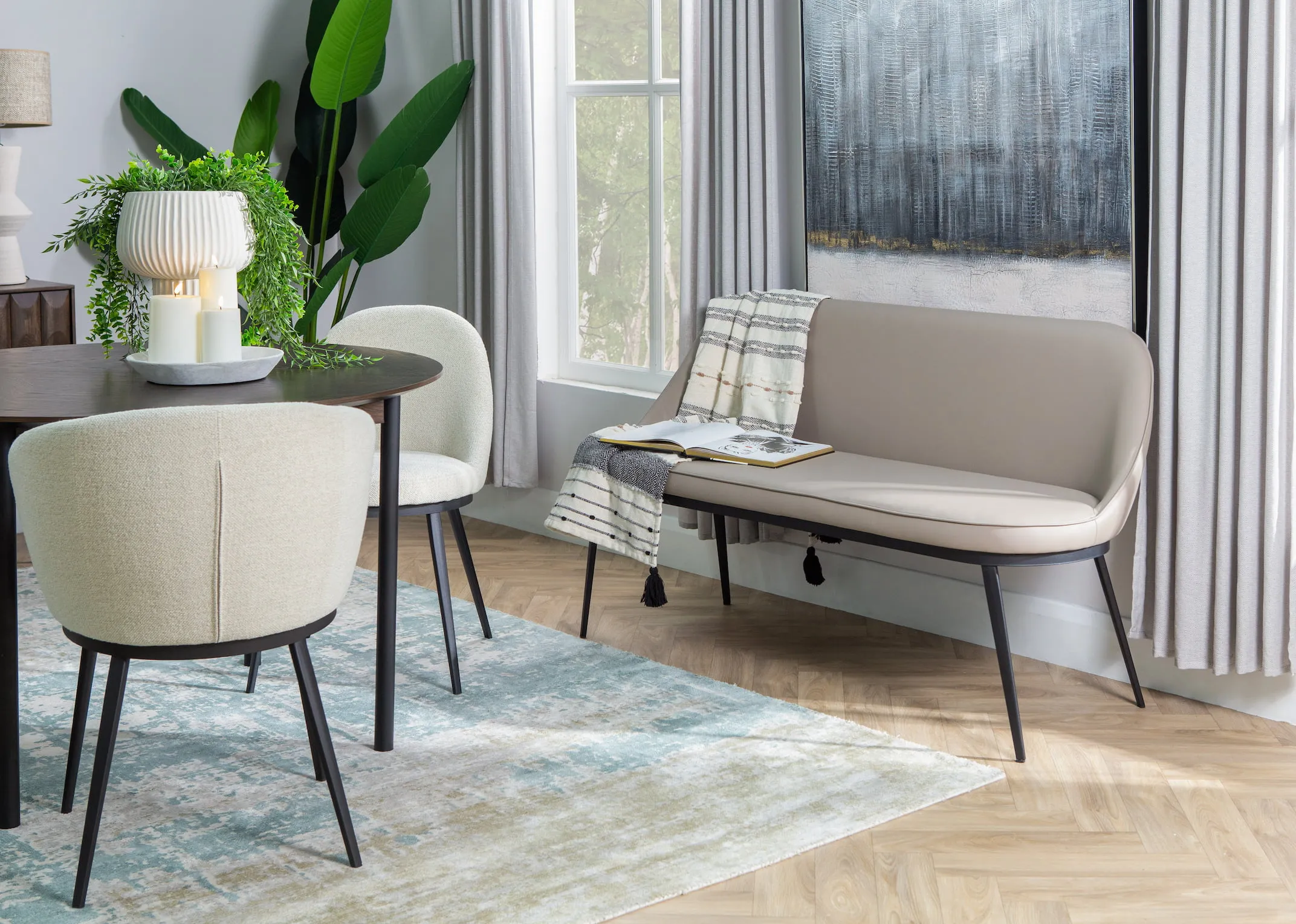 A lifestyle image of the Gain sofa bench against a wall with the Stormy print with the Latina table.