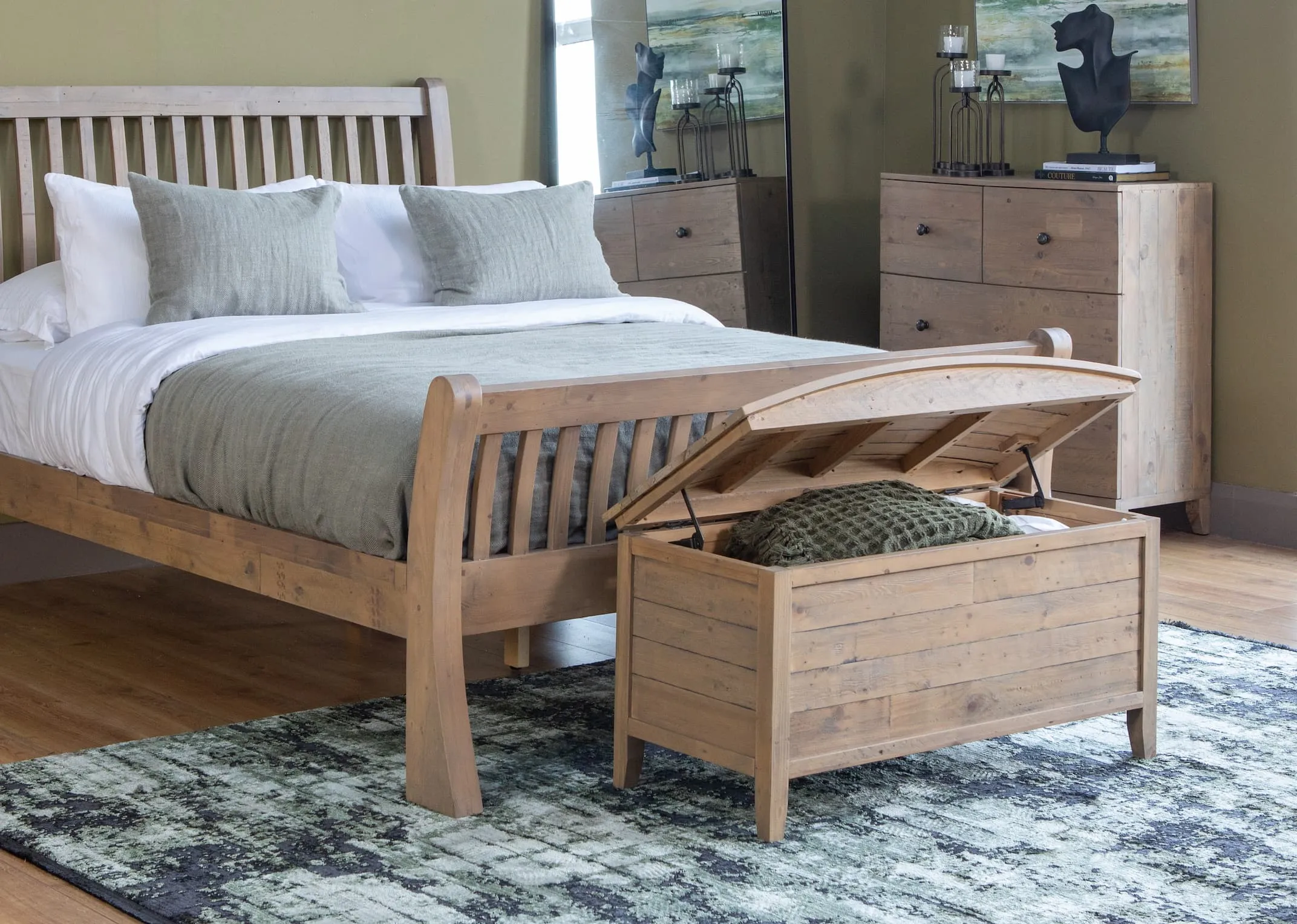 A lifestyle image of the Bria bedframe with curved edges and Bria blanket box with Rima rug