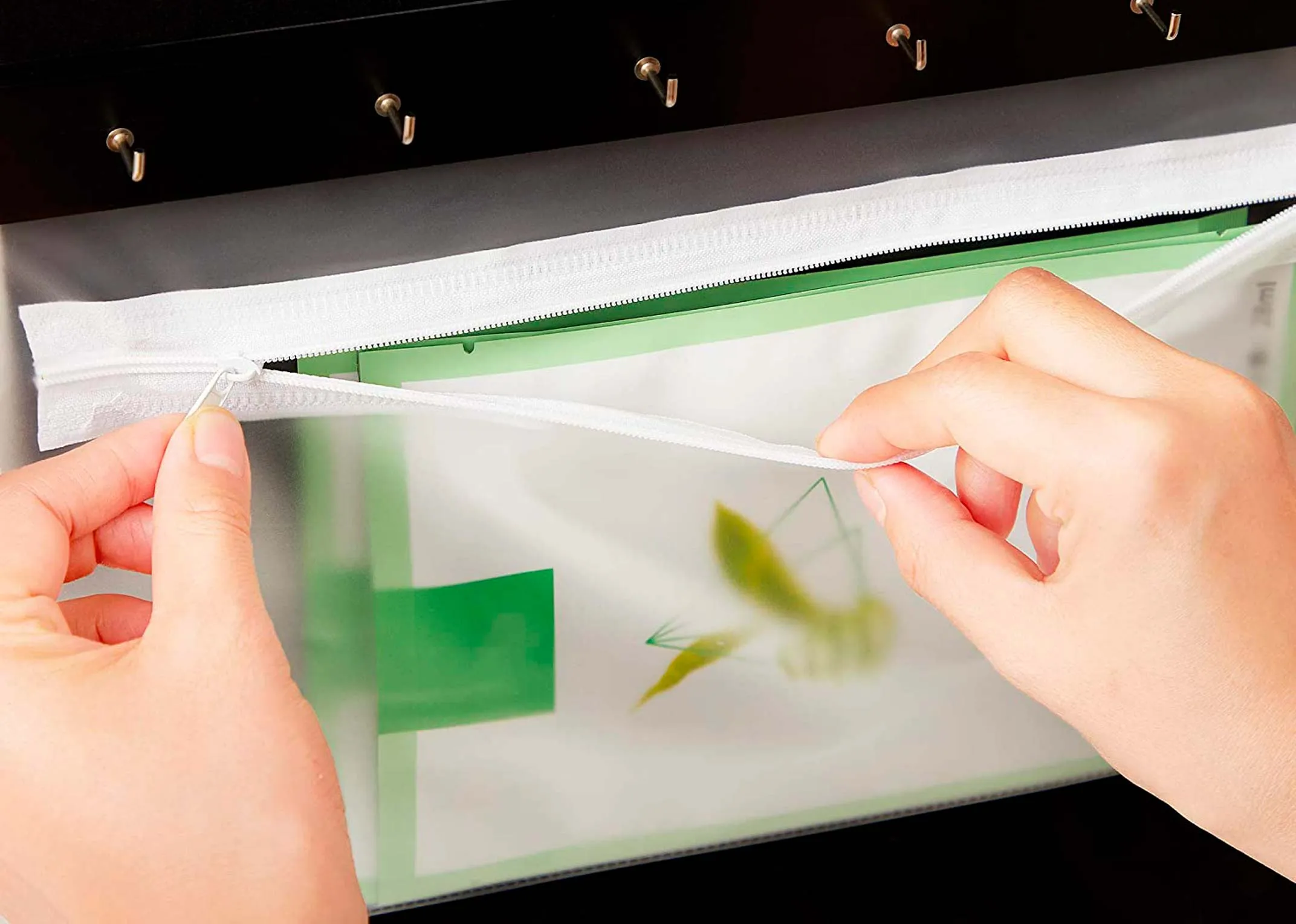 A white rectangular full length armoire from EZ Living's Amie range. Closeup of lock & key for jewellery