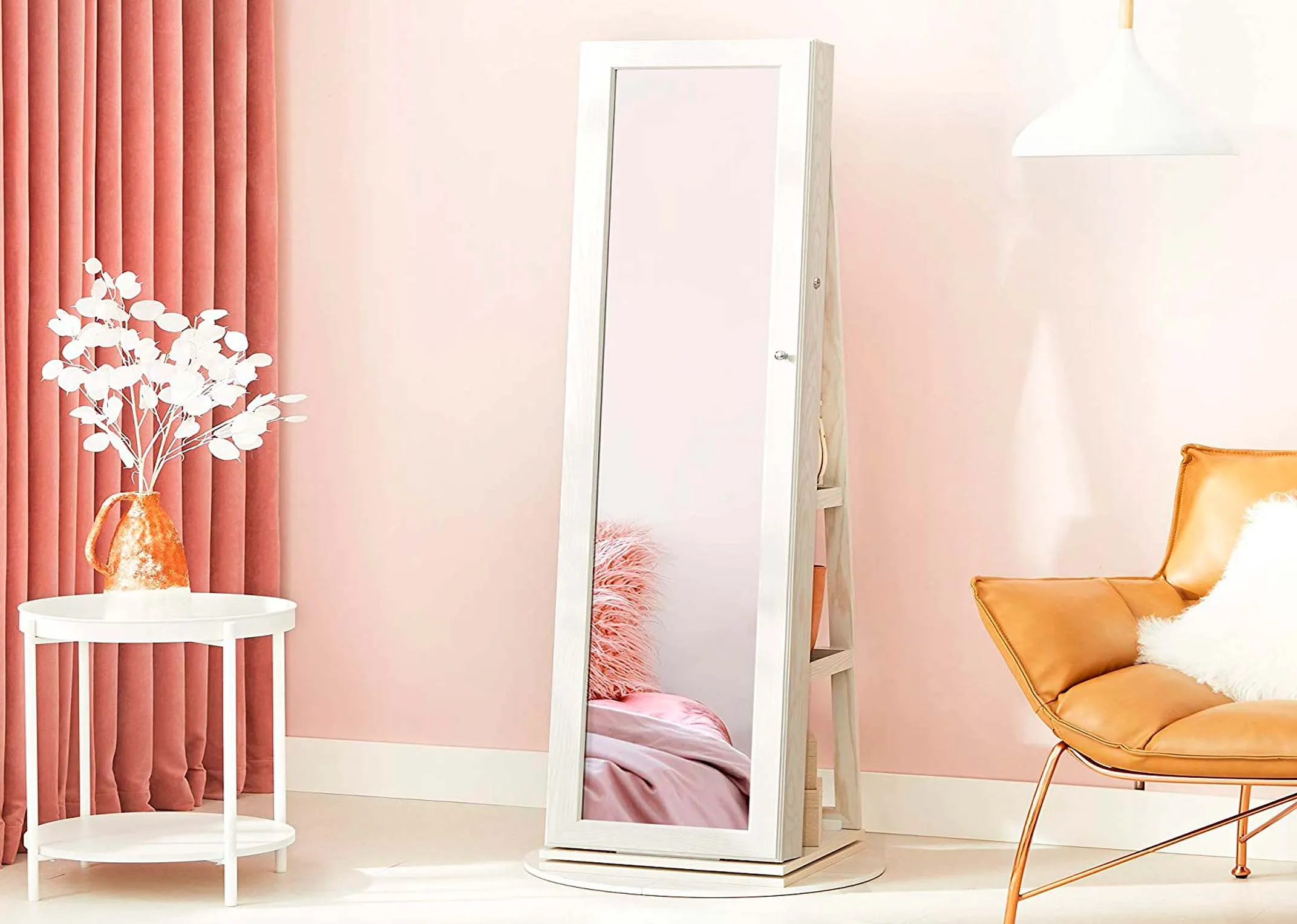 A lifestyle image of the Amie Jewellery Armoire in a dressing or bedroom as a mirror