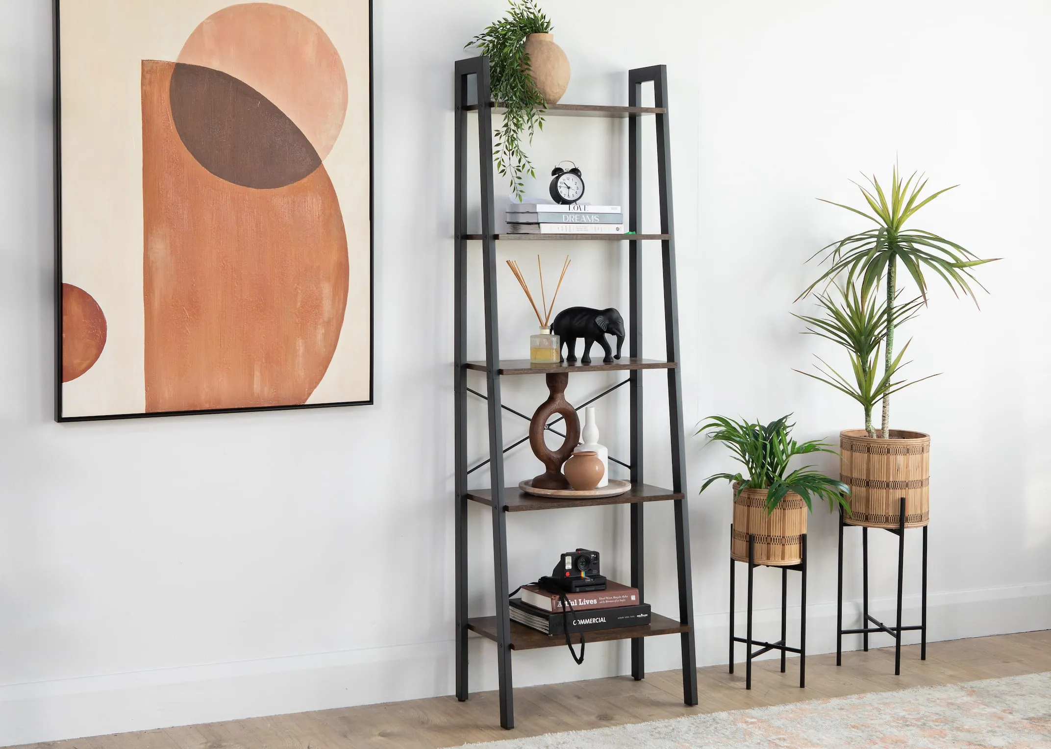 A lifestyle image of the Lear Shelves with a selection of ornaments and perception canvas from EZ Living Furniture.