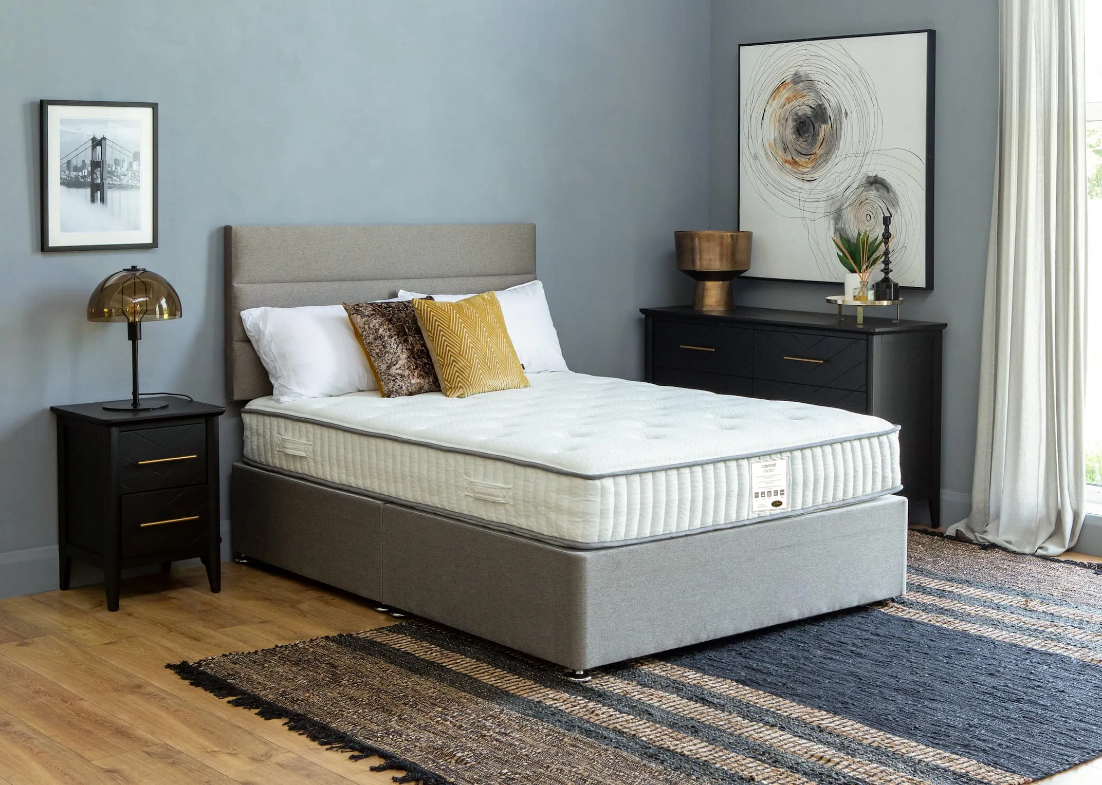 A lifestyle image of the Comfort Pocket mattress with Venice bed base & Circles print with Vagium rug.