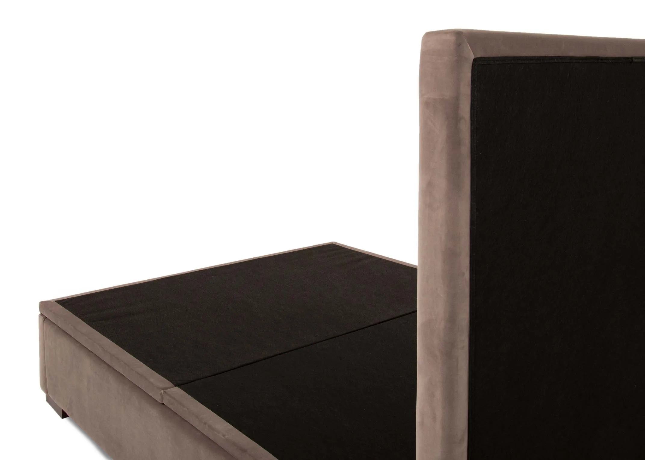 A taupe velvet ottoman bed with tufted high headboard from EZ Livings Majestic range. Angled view of bed without mattress showing flat base