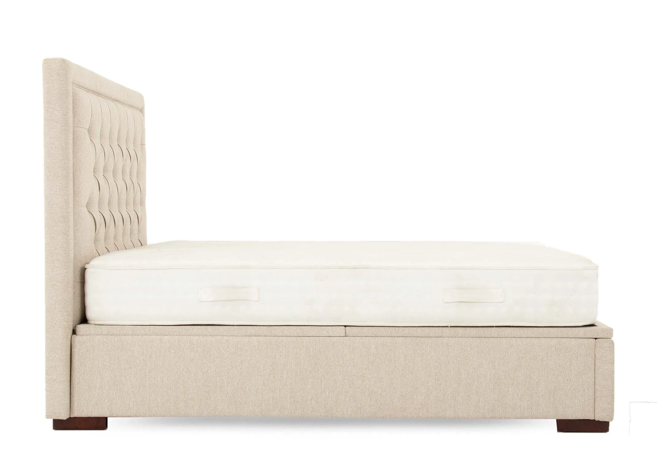 A double cream fabric ottoman bed from EZ Livings Majestic range. Side view of thick base for storage