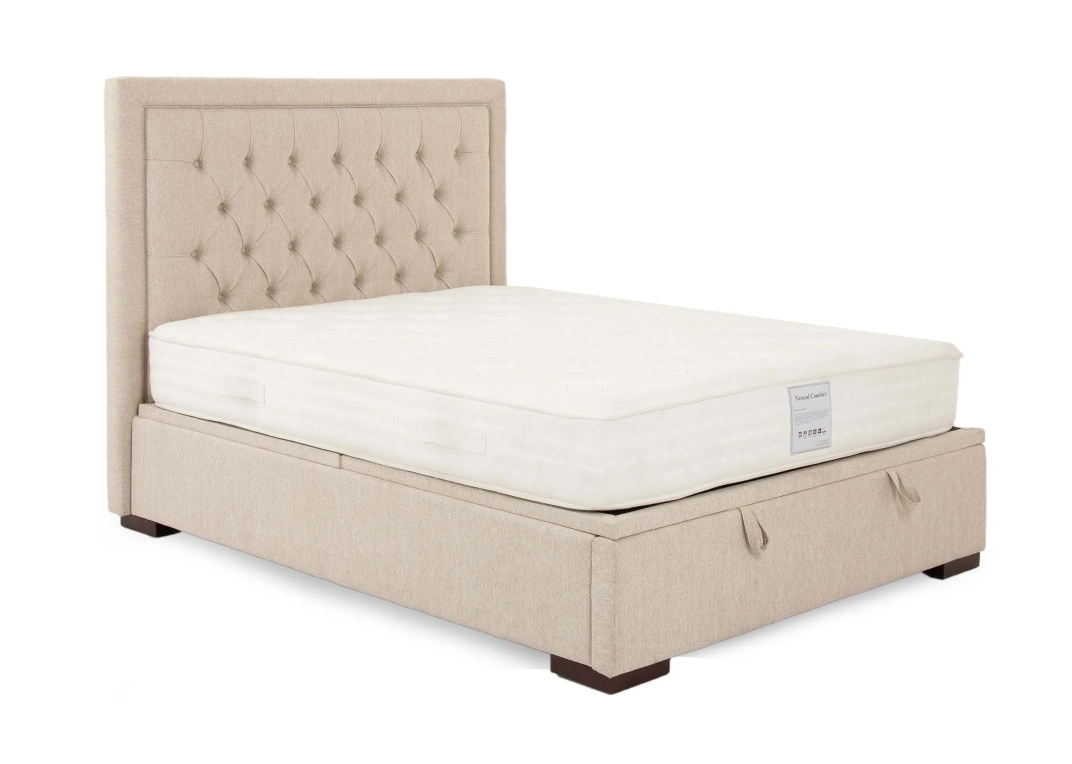 A 5ft cream fabric ottoman bed from EZ Livings Majestic range. Angled view of bed with mattress and handles on end to pull open.