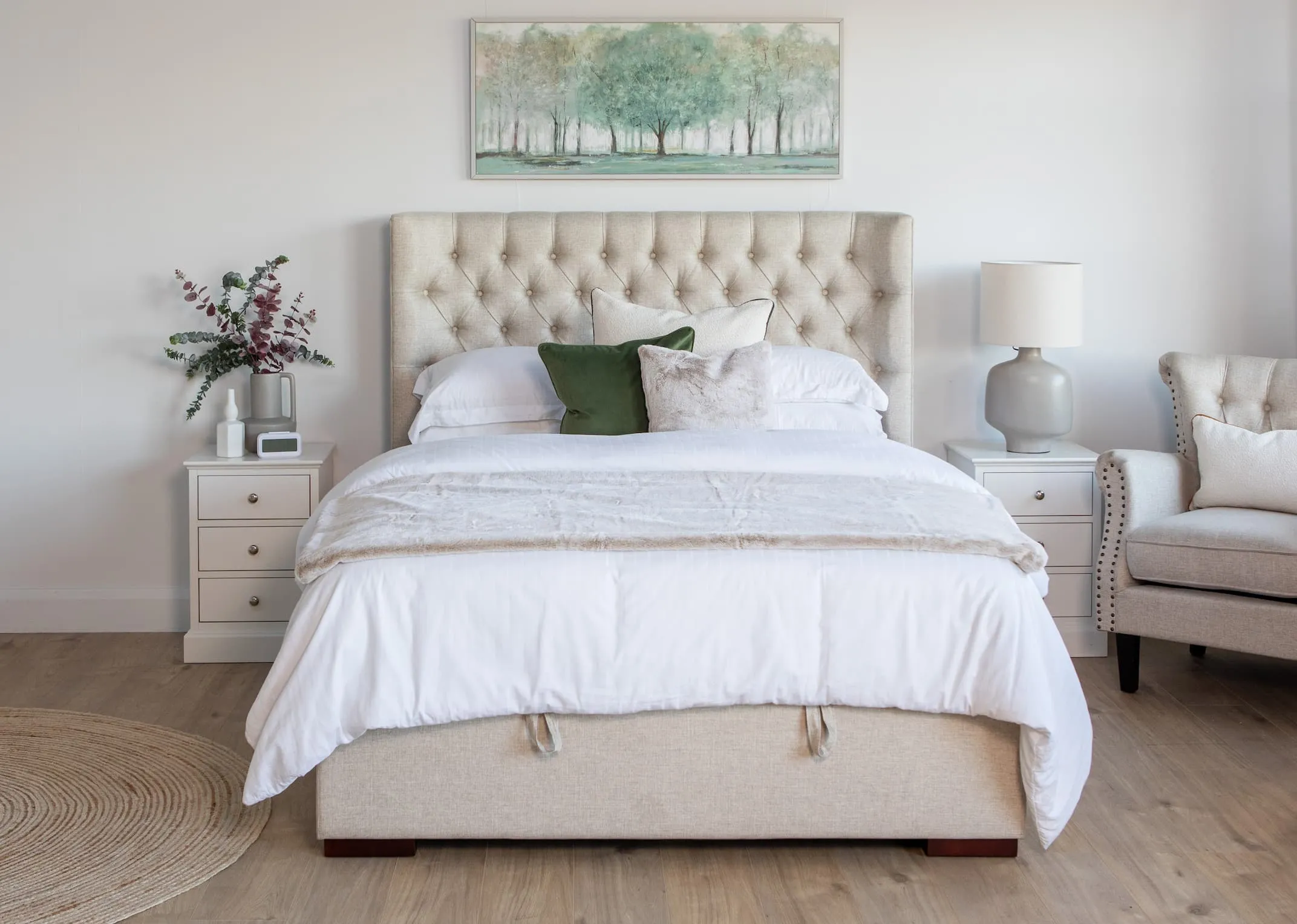 A 4ft 6 double beige linen fabric ottoman from EZ Livings Chester range. Side view of bed open to the side