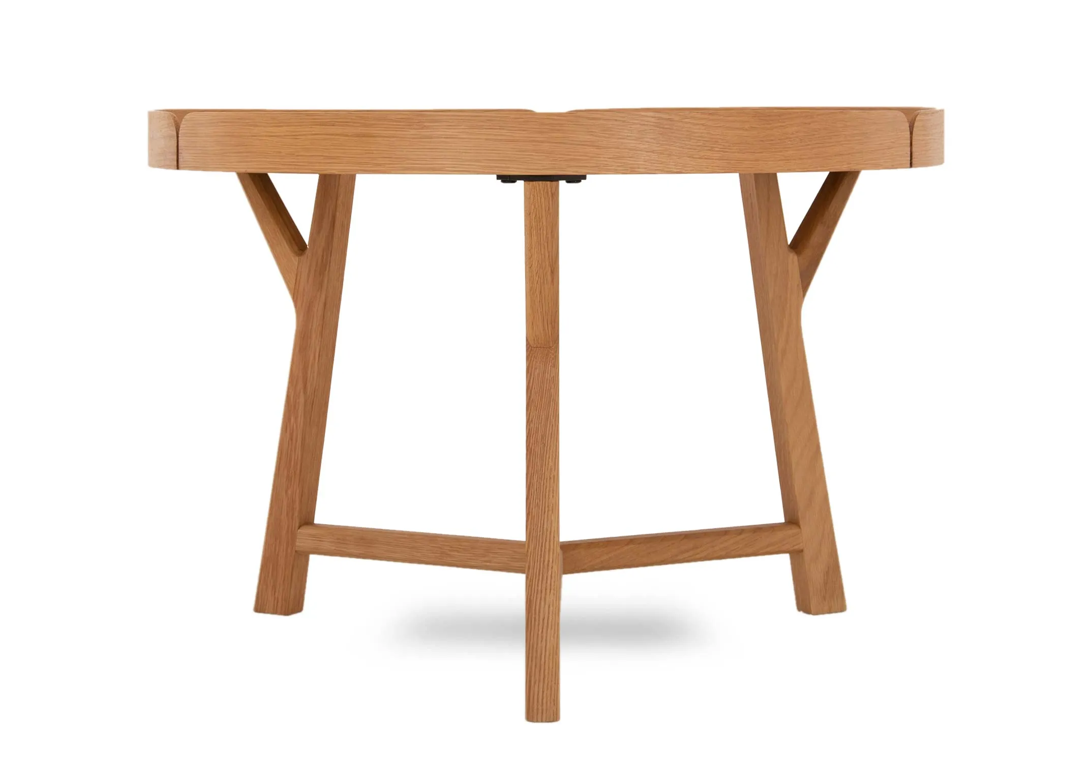 A low oak round coffee table from EZ Livings Trieste range. Closeup of tray table top