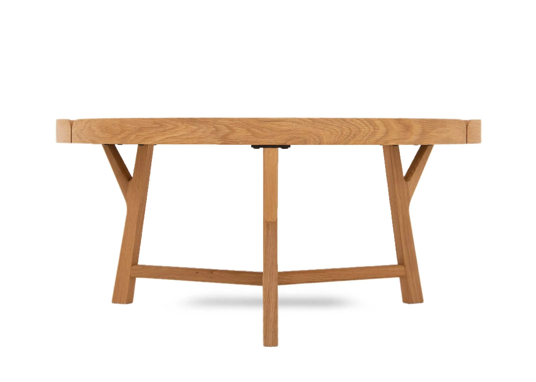 A round solid oak coffee tray table with tripod stand from EZ Livings Trieste range.  Closeup of solid oak finish