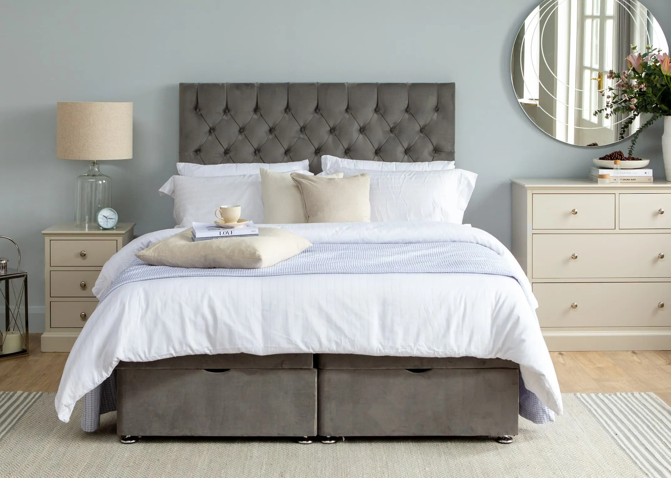 A lifestyle image of the Palermo Headboard with Ottoman bed with full opening and Rivendale grey locker & Chest