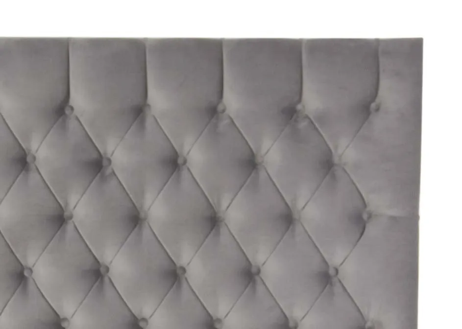 A grey velvet button detail headboard in 4ft6 from EZ Livings Palermo range. Closeup view of tufted buttons