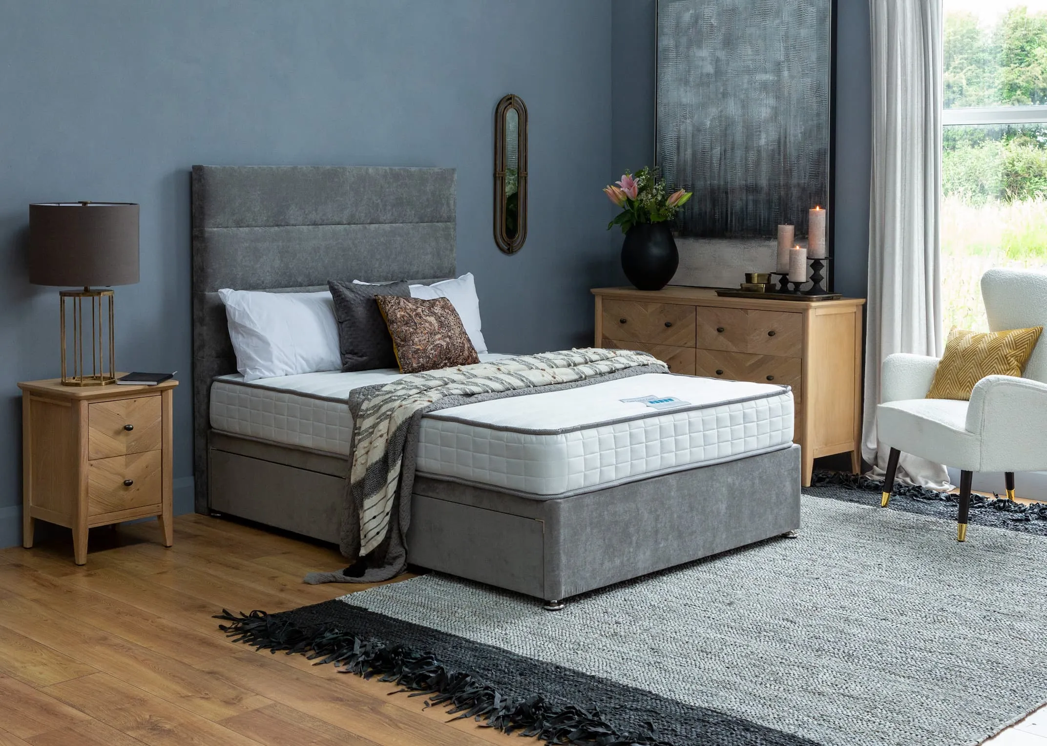 A lifestyle image of the Venice bed with classic comfort mattress and chevron locker & chest