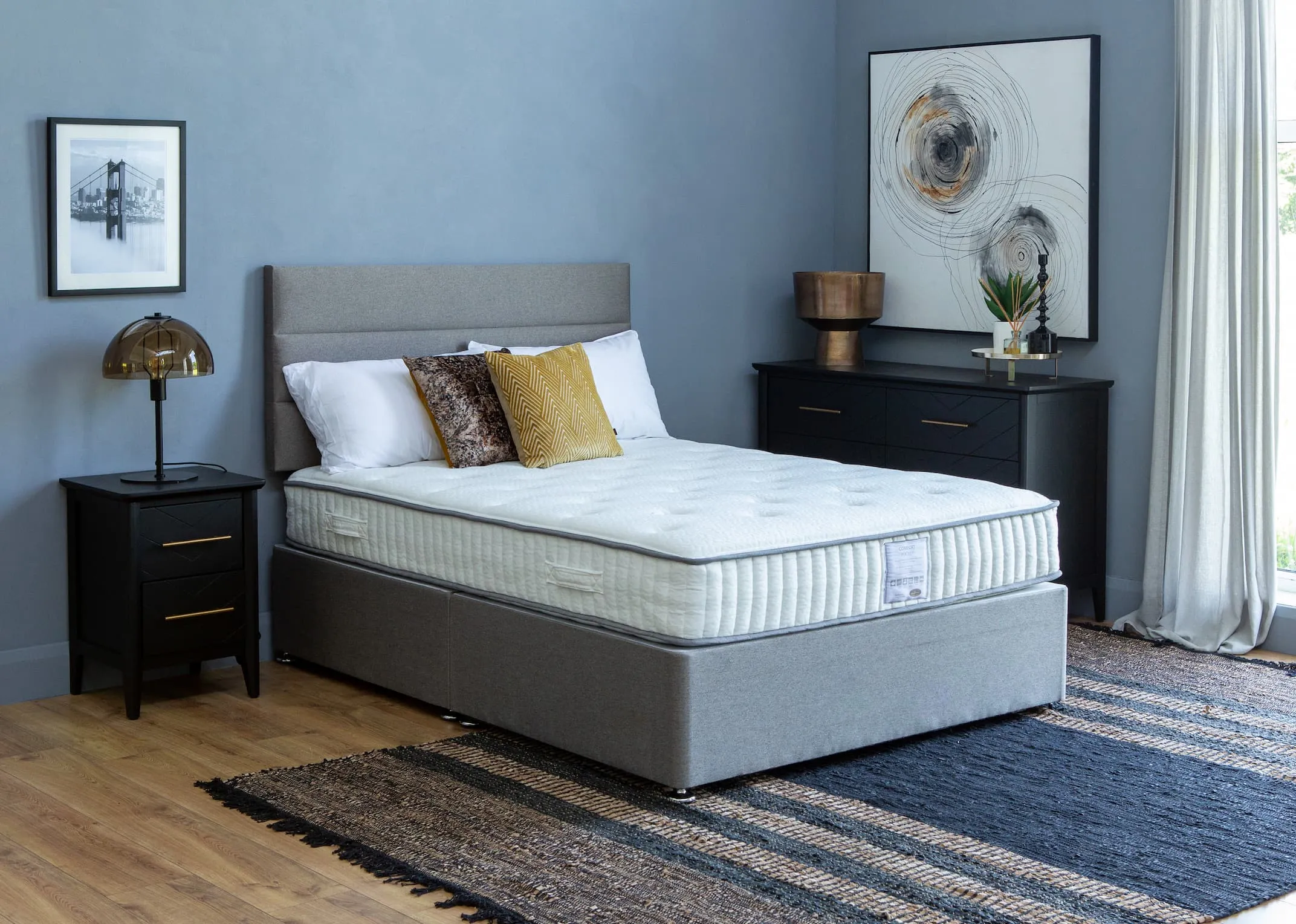 A lifestyle image of the Florence Headboard with Venice divan base & Chevron black furniture