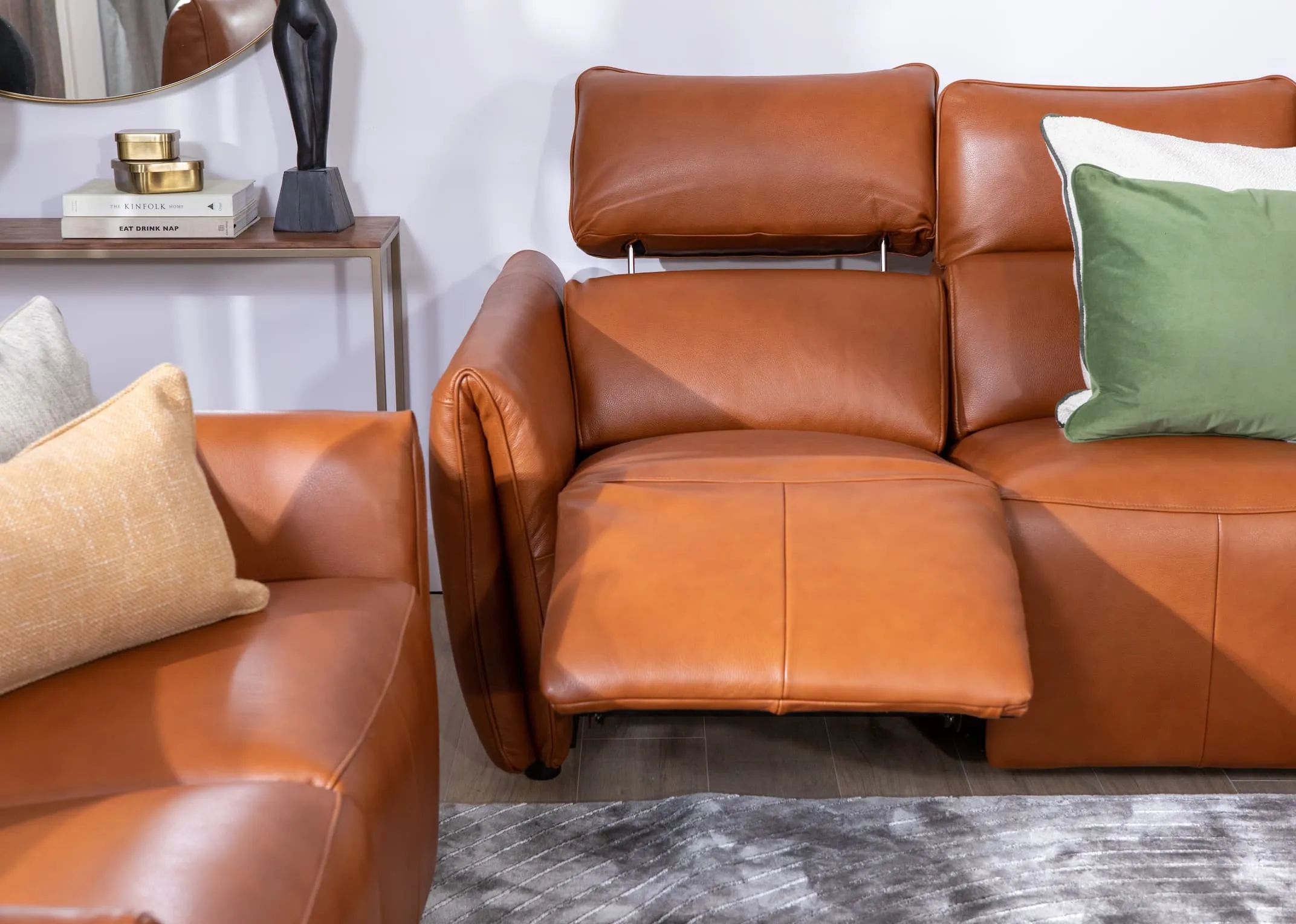 A lifestyle image of the Icon sofa range with 3 seater reclined in closeup showing head tilt