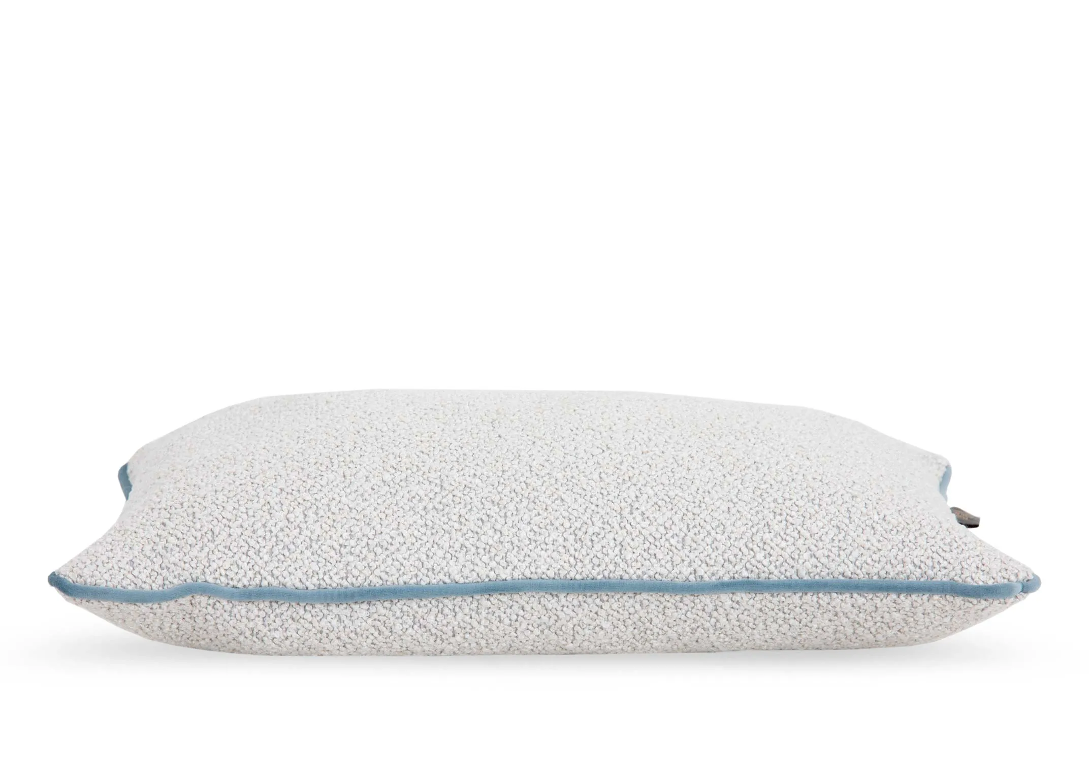 A ivory bolster cushion with pale blue trim from EZ Livings Leighton range. Side veiw.