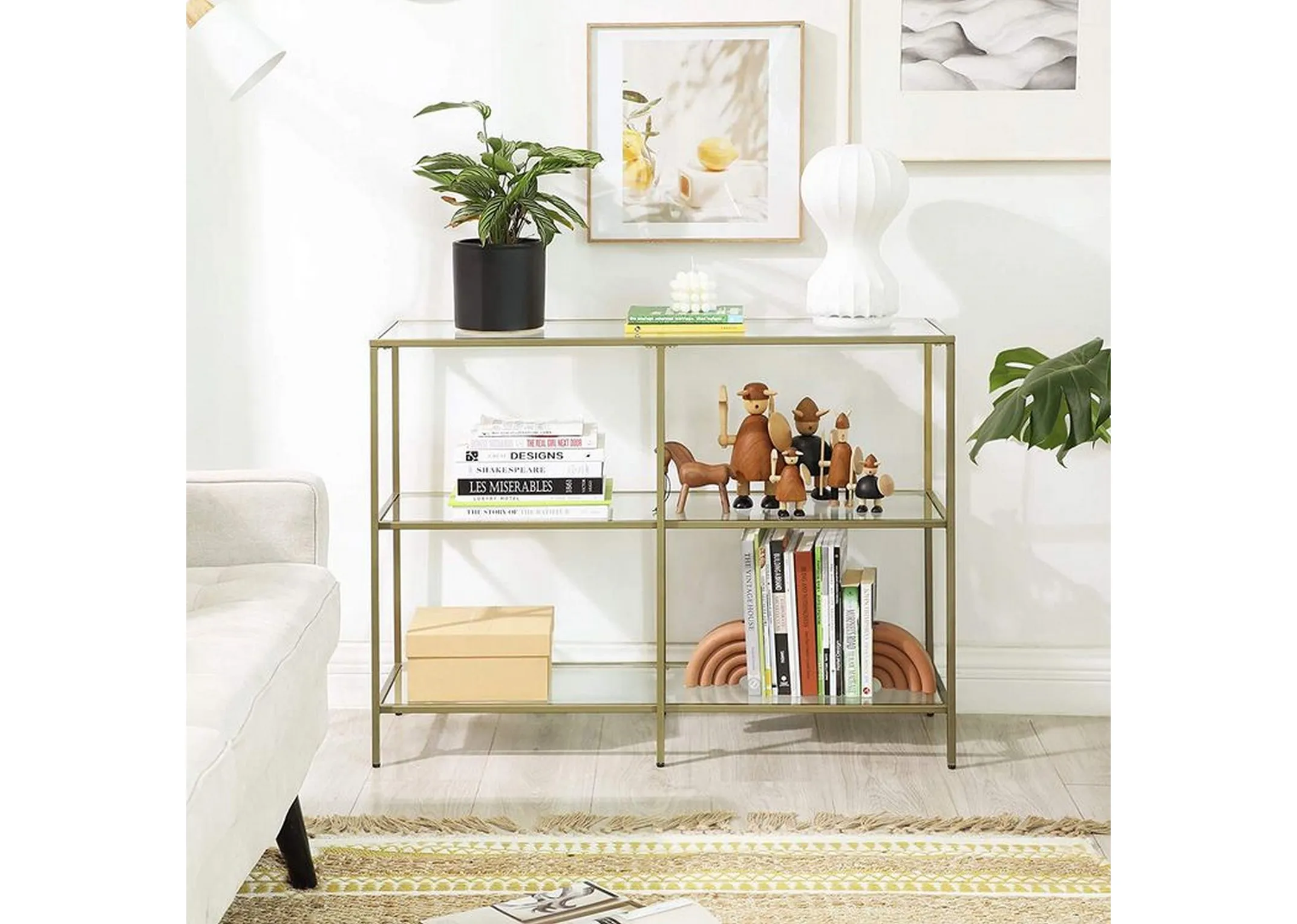 A gold frame rectangular storage rack with glass shelves from EZ Livings Zafon range. Closeup pf easy to scre in protective f