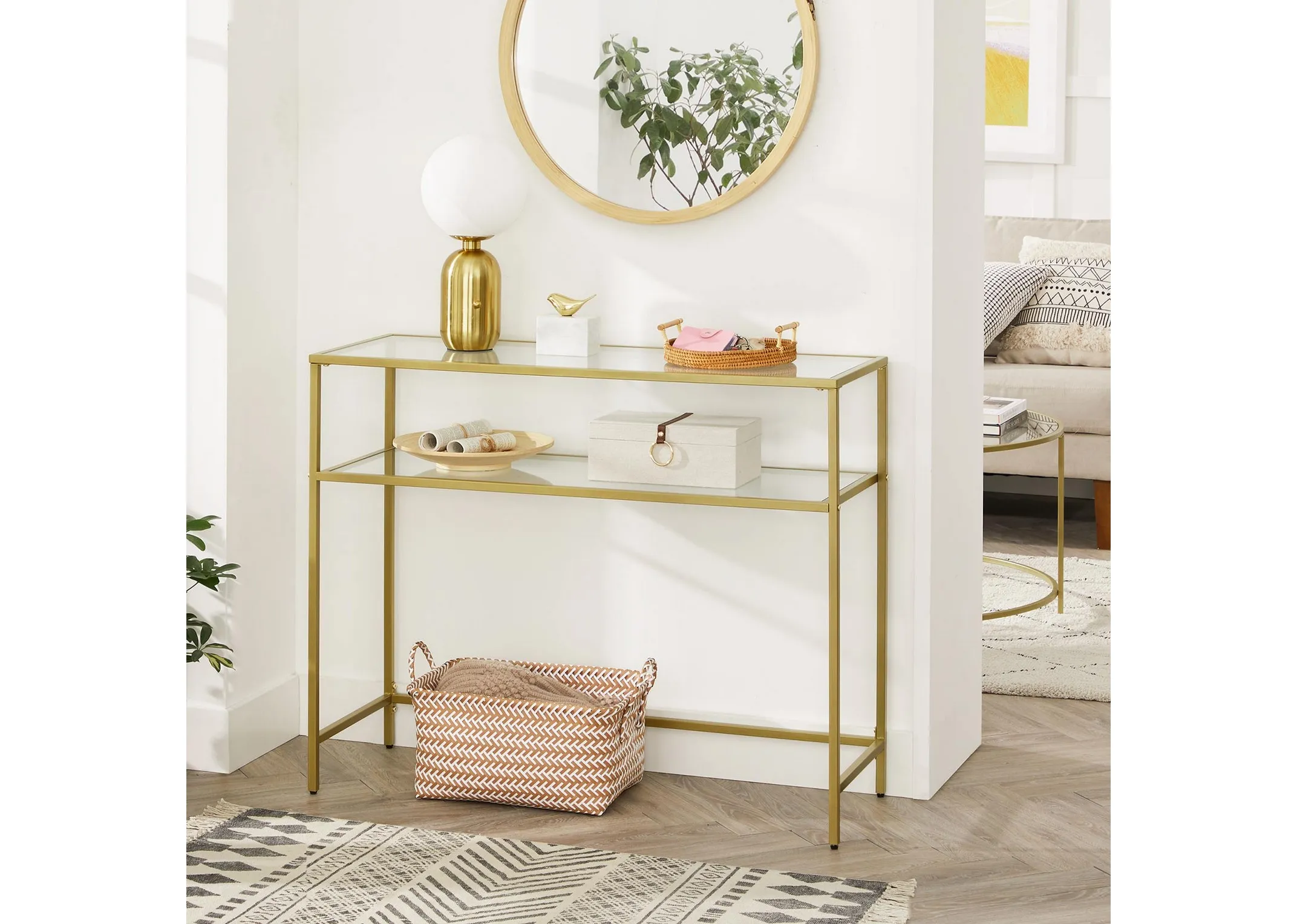 A lifestyle image of the Zafon Console Table with a mirror above and basket beneat & shelevs accessorised..