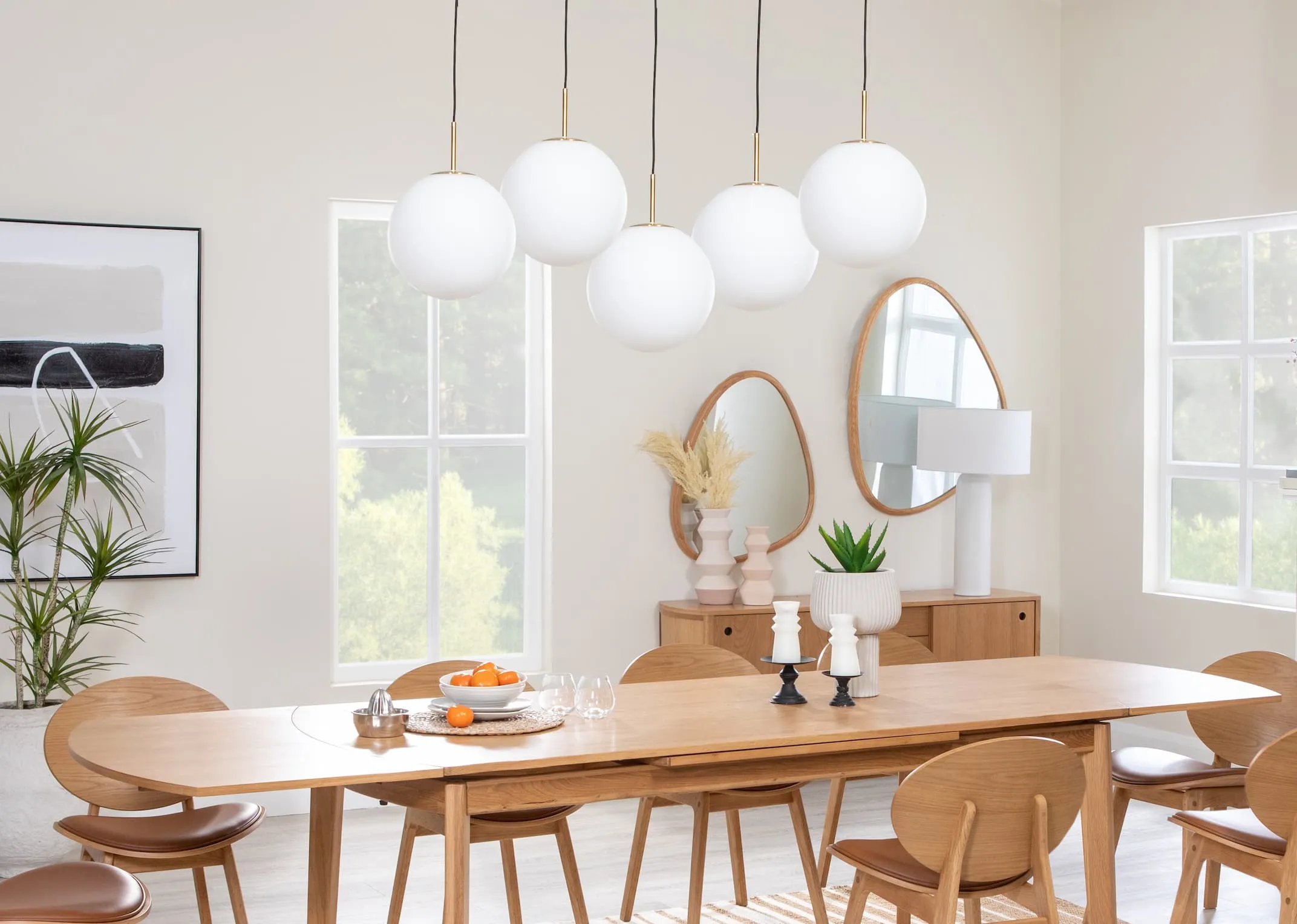 A lifestyle image of the Copenhagen dining range with 5 single Medina lamps hanging as a feature.