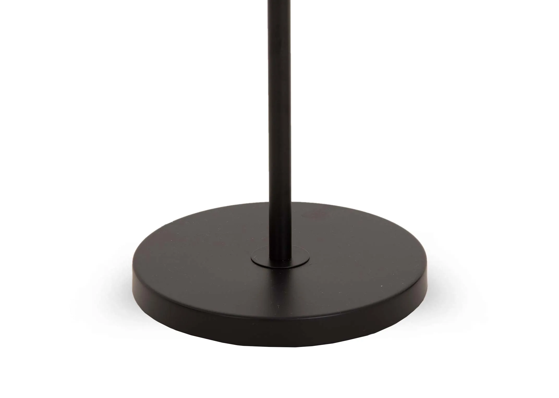 A black metal floor lamp with smoked grey glass shade from EZ Livings Leanne range.  Closeup of round base