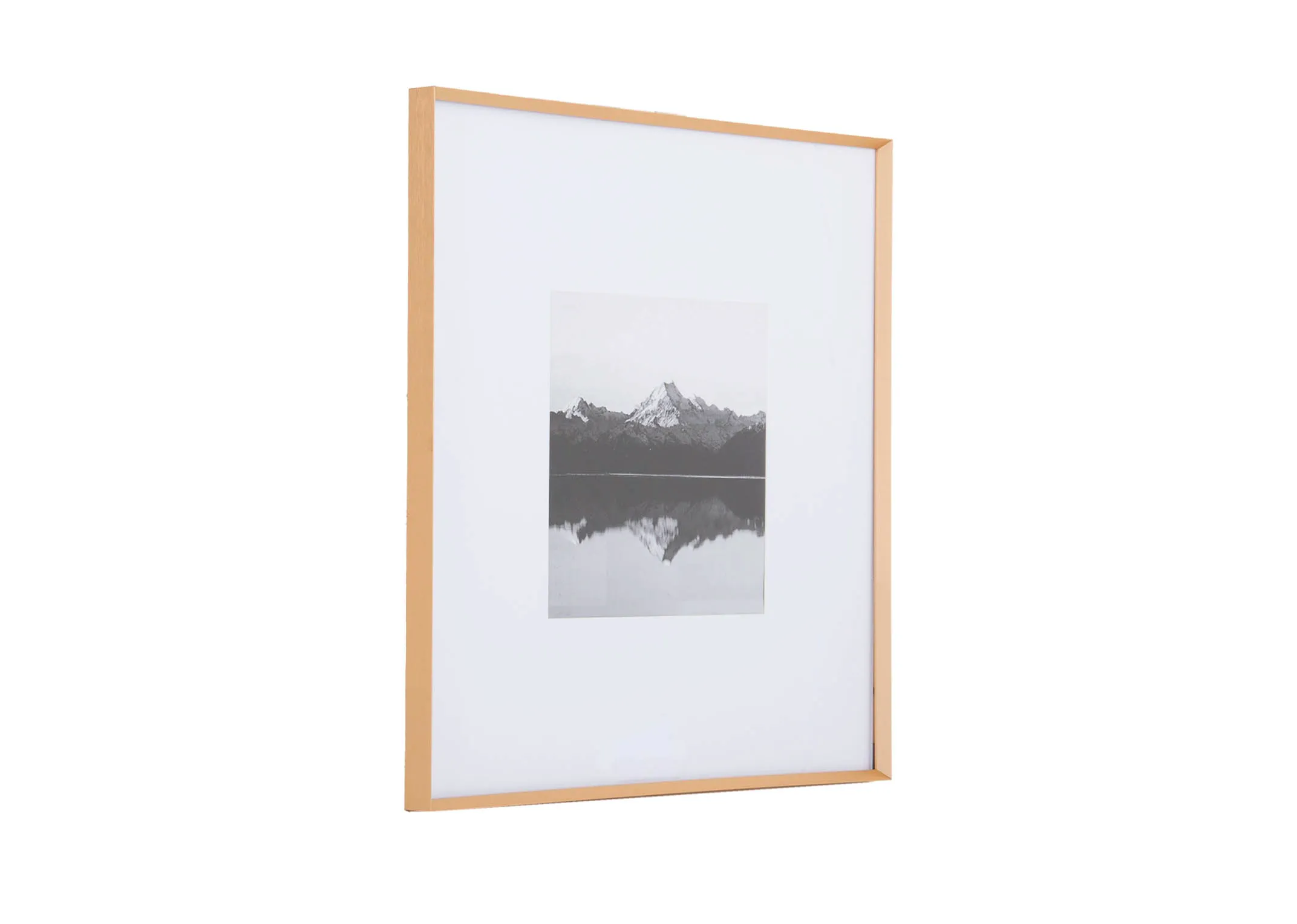 A medium brass photo frame with wide white inlay from EZ Livings Arabel range. Angled view