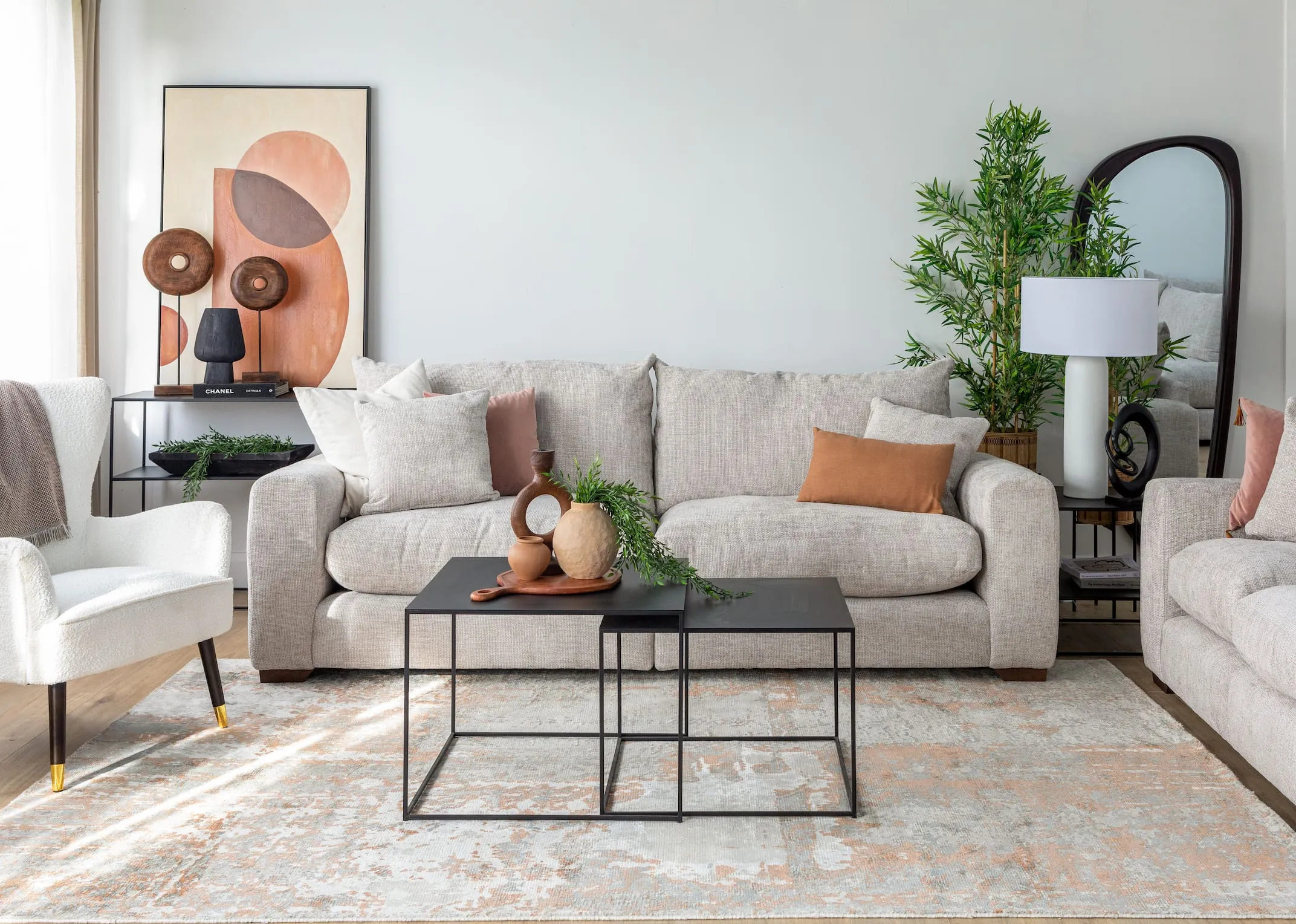 A lifestyle image of the Aurora 4 seater sofa with malta nests & modesto rug