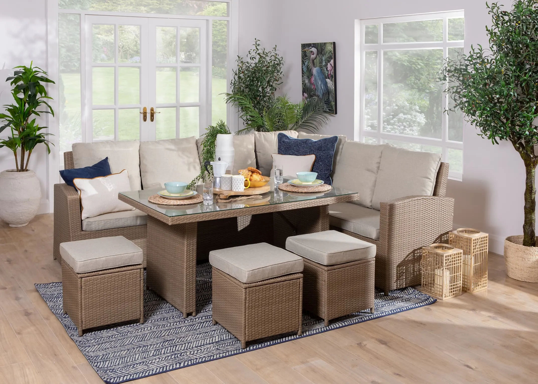 A lifestyle image of the Malaga Corner Garden sofa set with sofa