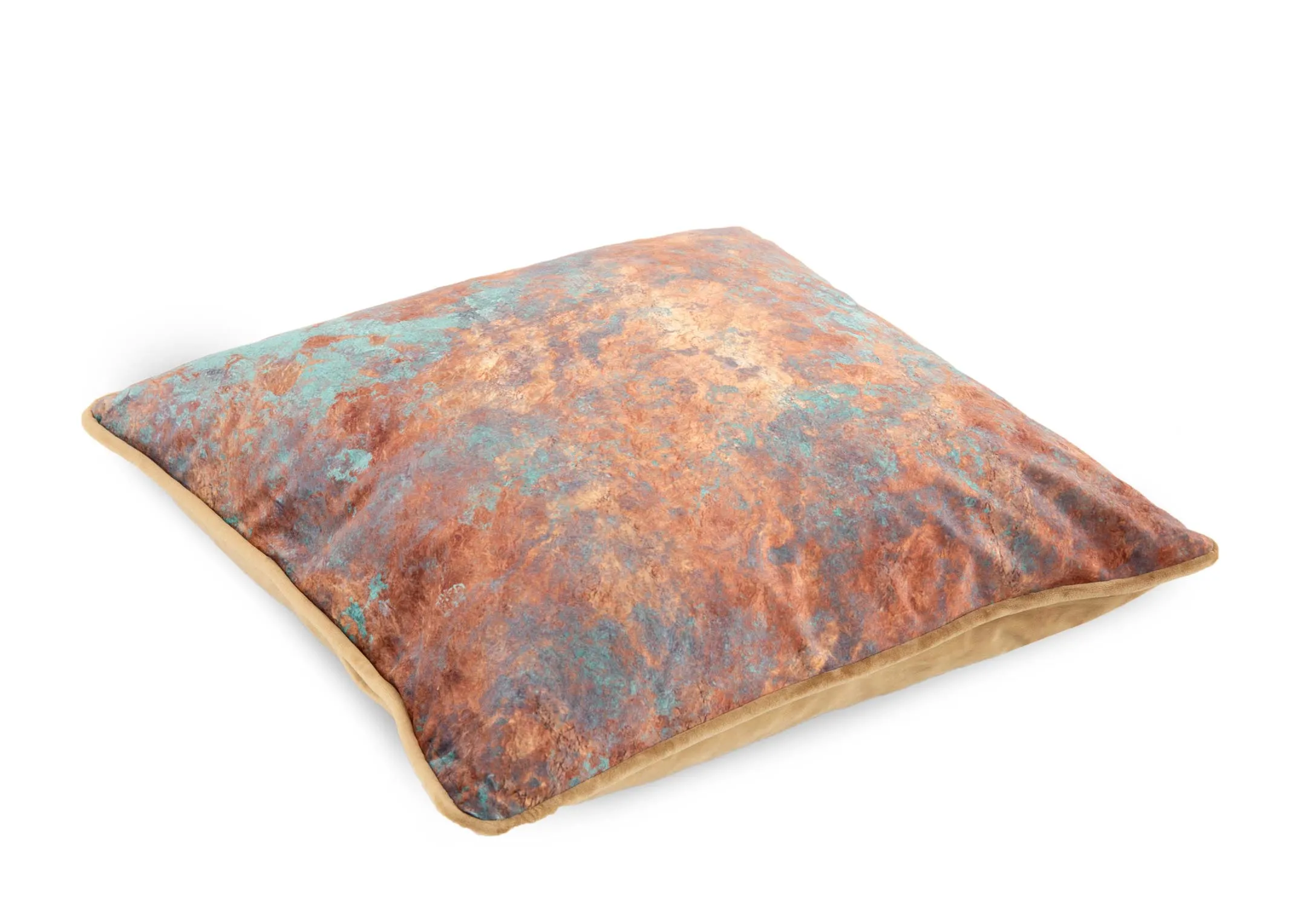 A rust cushion with teal patches from EZ Livings Cushion range. Angled view