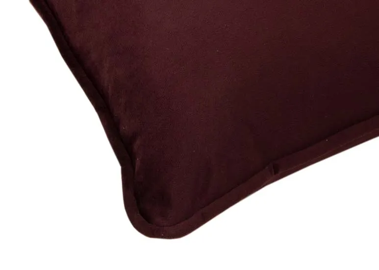 A plum velvet cushion from EZ Livings Cushion range. Closeup of trim