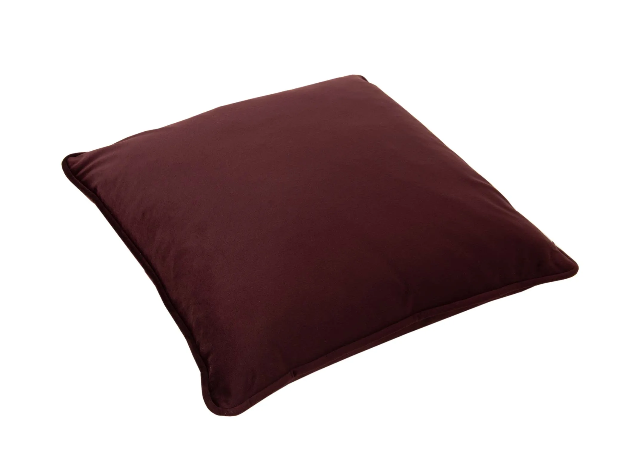 A plum velvet cushion from EZ Livings Cushion range. Angled view