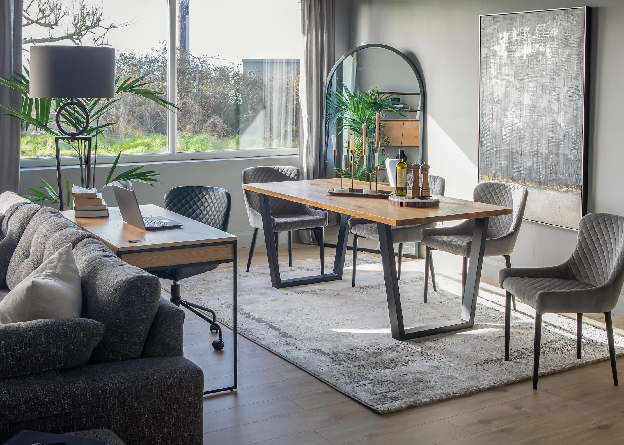 A lifetsyle image of the Reno table with Ottowa grey dining chairs with Stormy print
