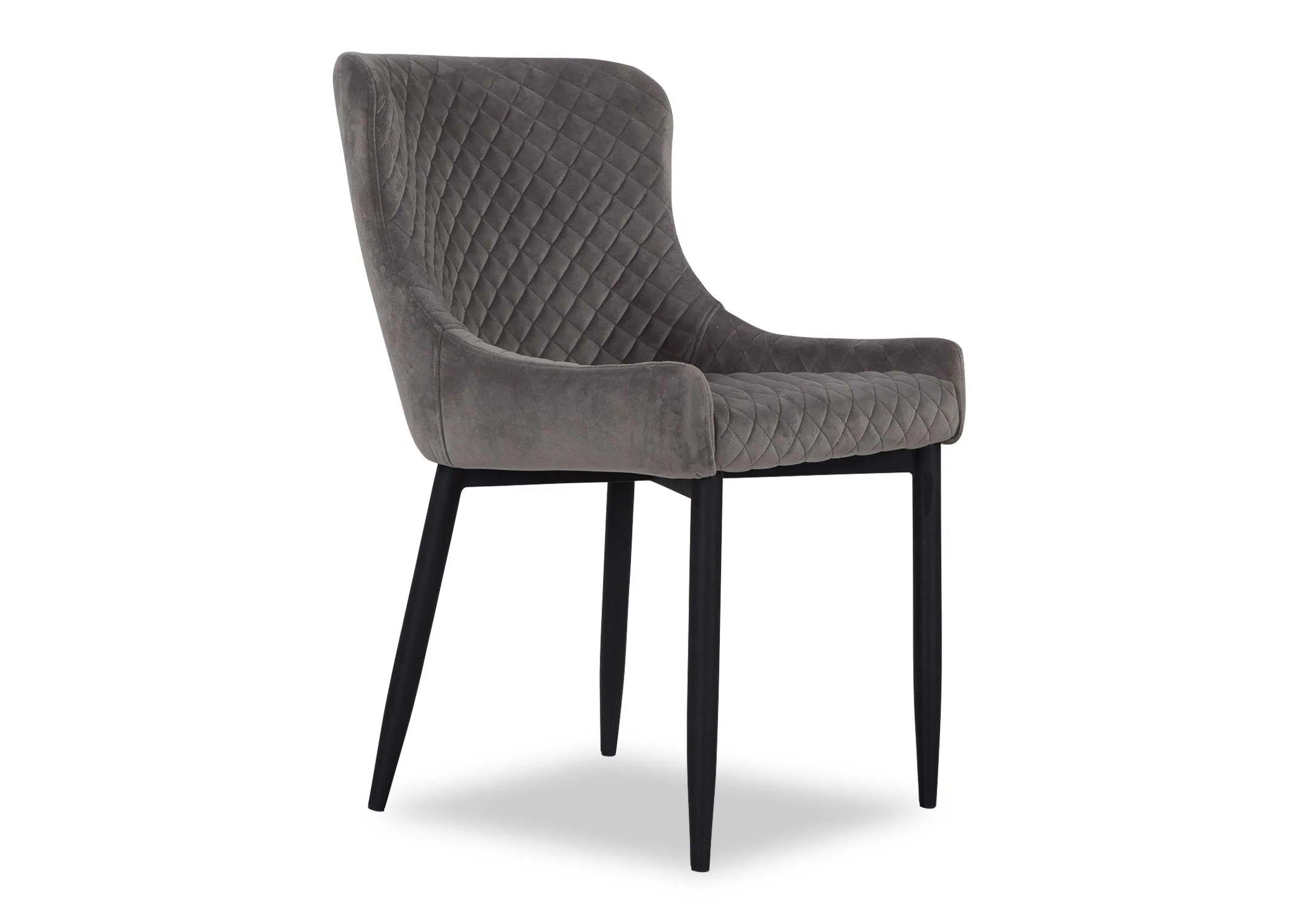 A grey velvet dining chair from EZ Livings Ottowa range. Angled view of cushion detail.