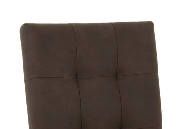 A gold metal cantilever dining chair with black fabric seat and back from EZ Livings Greenwich range. Closeup of black fabric detail
