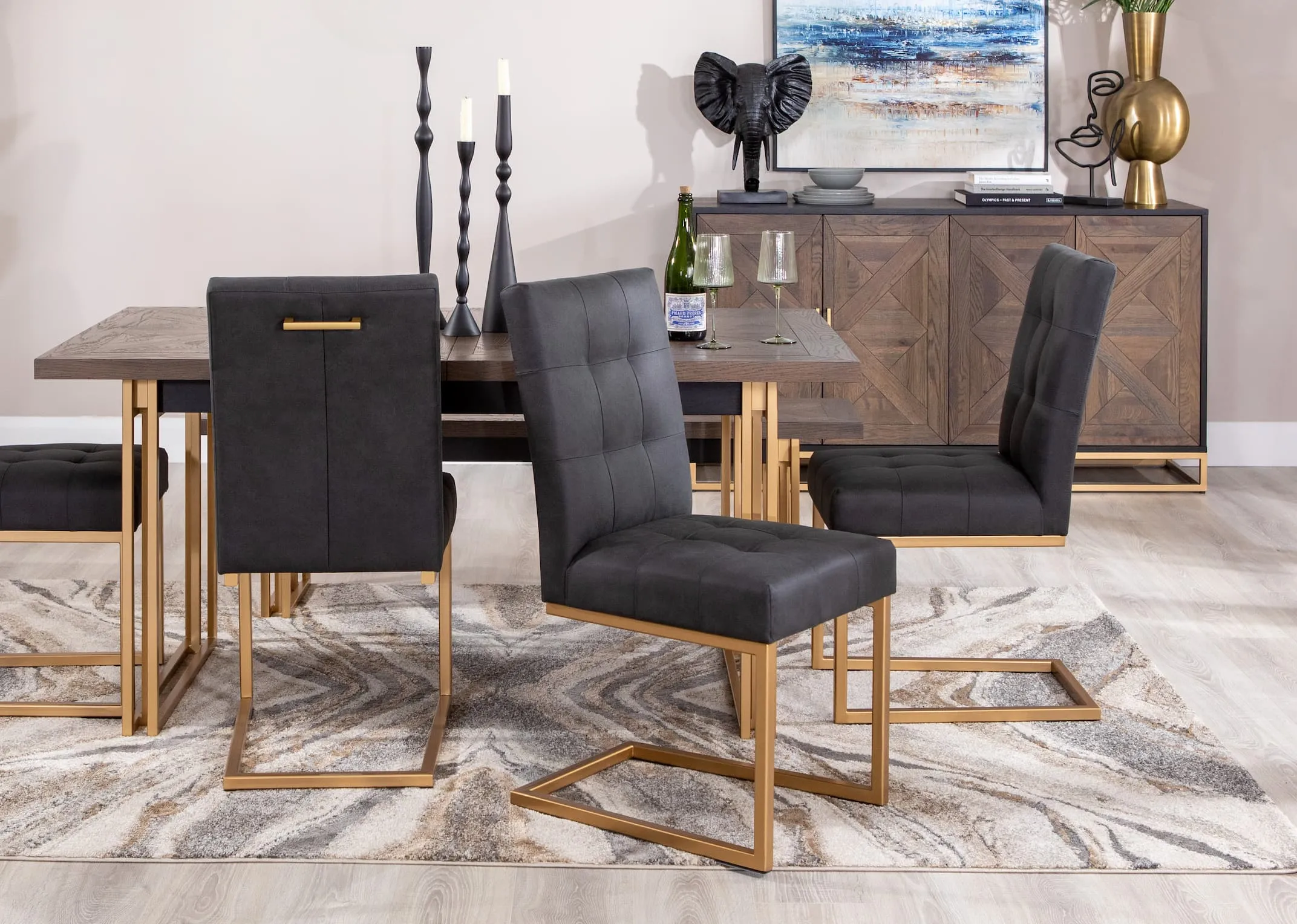 A lifestyle image of the Greenwich dining table with 3 Greenwich dining chairs with sideboard and Pasha rug
