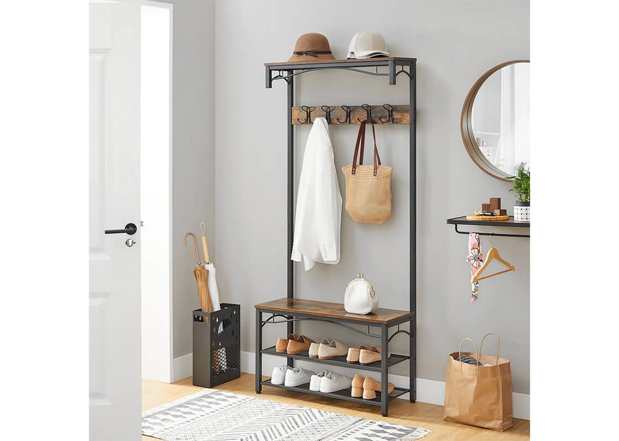 A lifestyle closeup of the Grimm coat stand in use in a bedroom