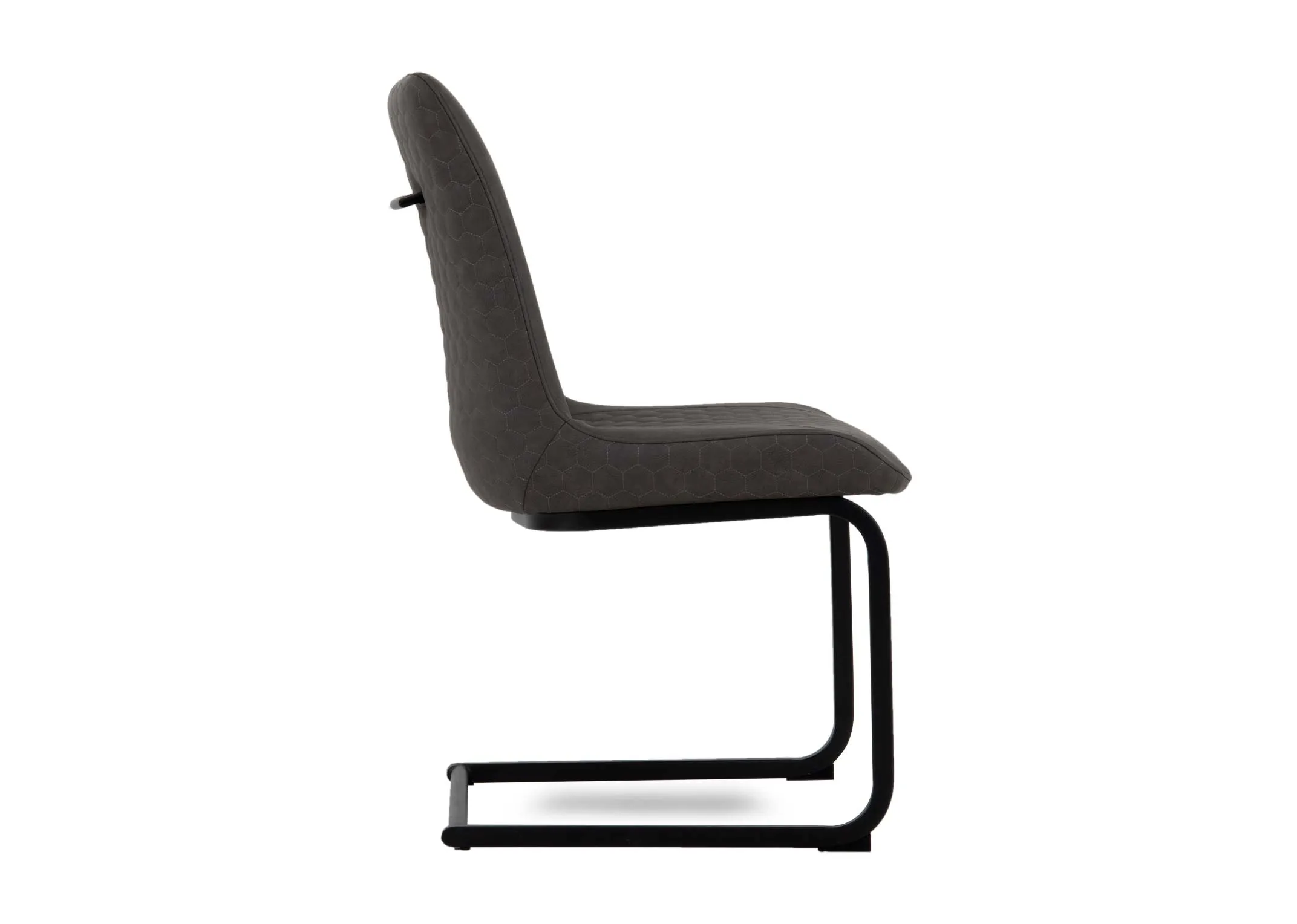 A dark grey faux leather dining chair from EZ Livings Barton Range. Side view of padded seat.