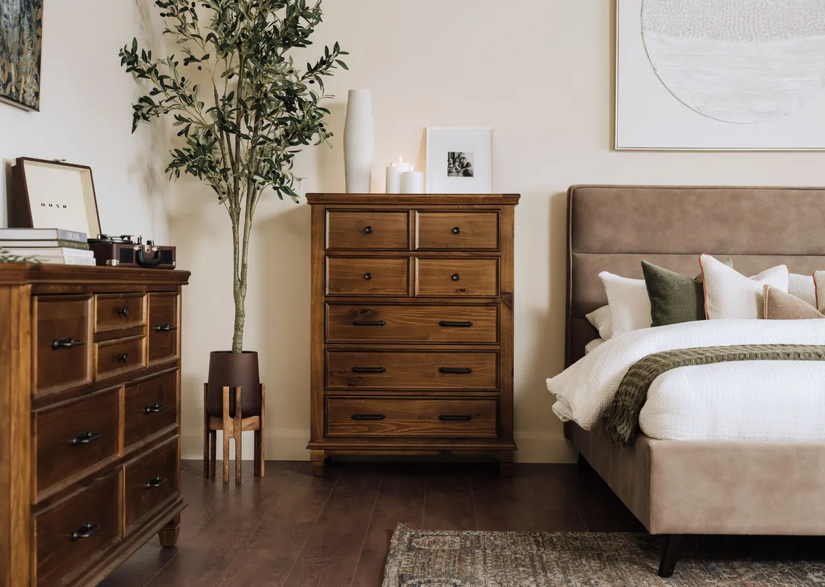 A lifetsyle image of the Allyson tallboy with Ebony bed and dresser.