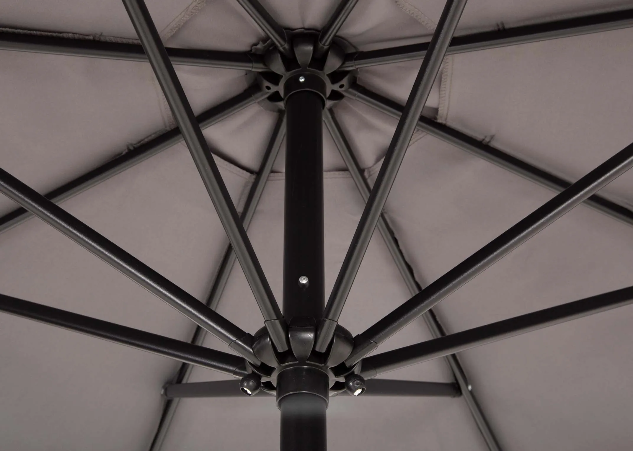 A grey garden parasol with granite basefrom EZ Livings Seville range. Closeup of air vent and spokes