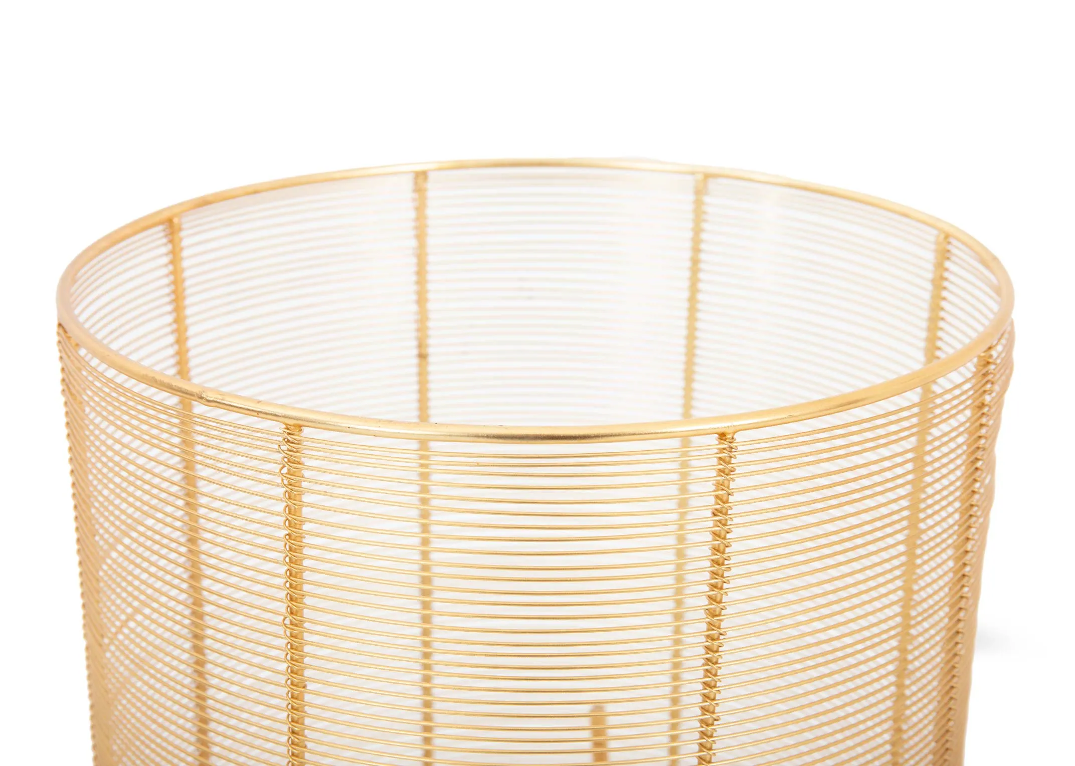 A small gold iron planter on tripod legs from EZ Livings Peyton range.Closeup of metal basket