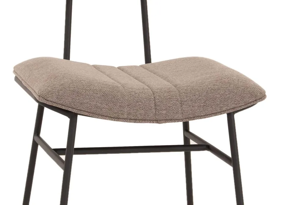 A metal frame dining chair with grey fabric seat and slim back from EZ Livings Decker range. Closeup of curved padded seat