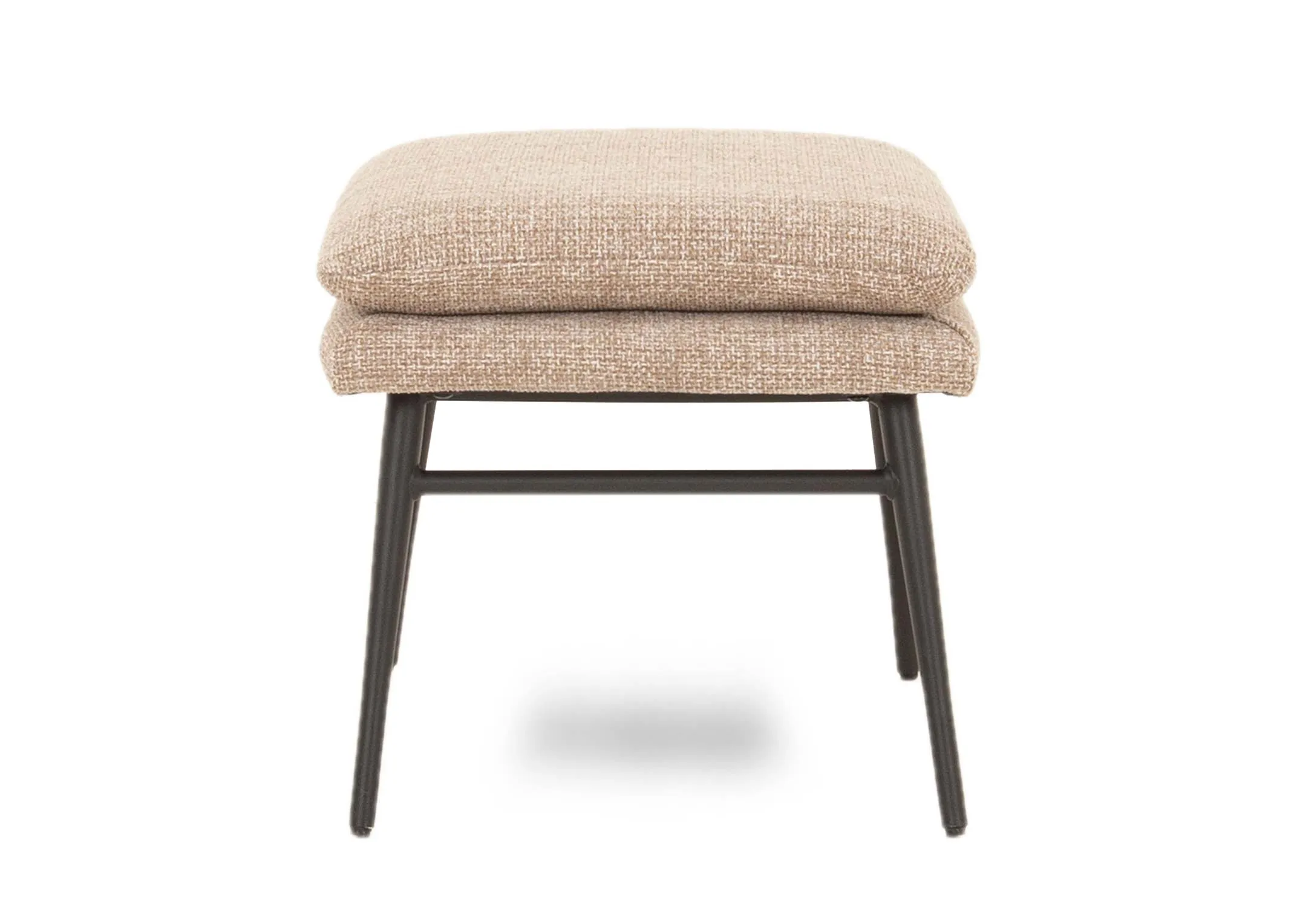 A beige fabric wing chair & footstool set from EZ Livings Boston range. Side view of footstool with black metal legs