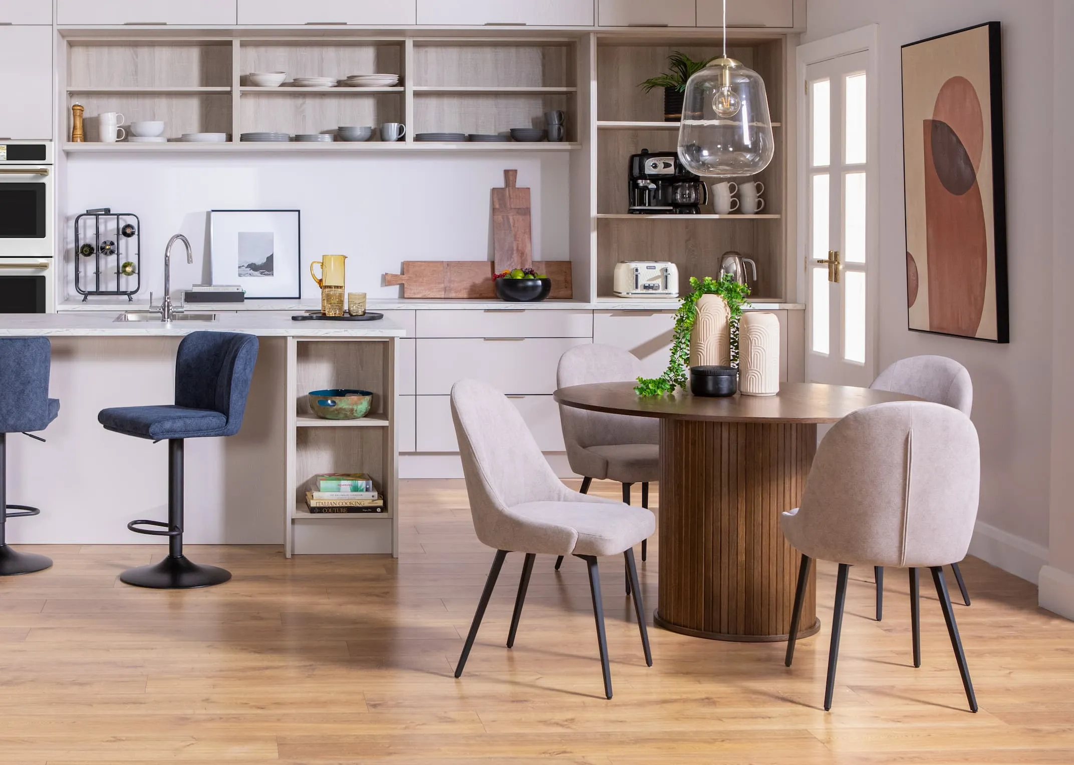 A lifestyle image of the Nola dining table with Jacob grey dining chairs.
