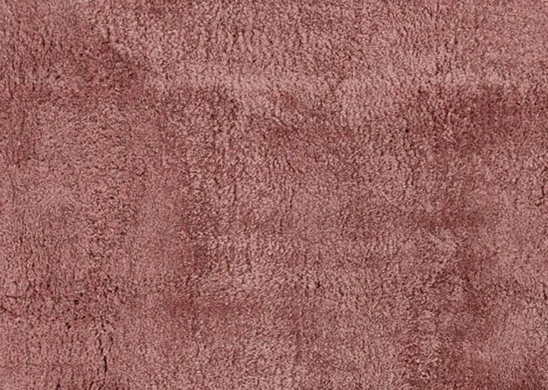 A coral pink deep pile rug from EZ Livings Lux range. Closeup of texture