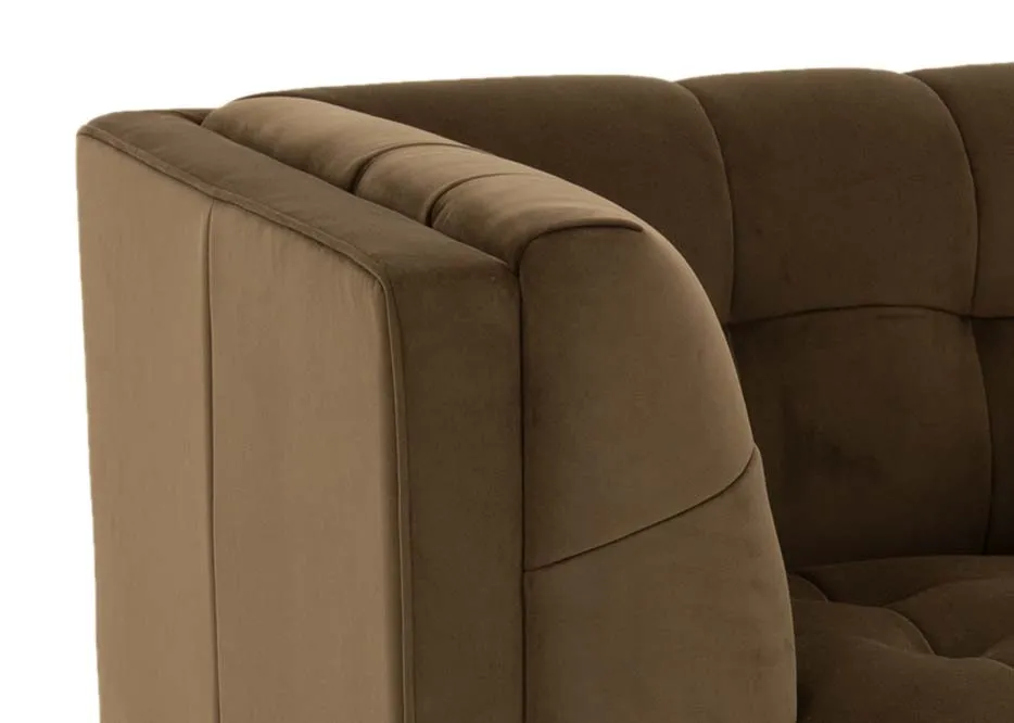 An olive green velvet armchair from EZ Livings Grace range. Closeup of luxury velvet fabric