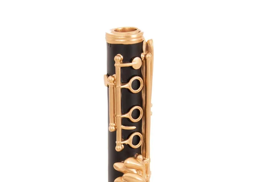 A black & gold Clarinet candleholder from EZ Livings Christmas range. Closeup of gold detail & opening for dinner candle
