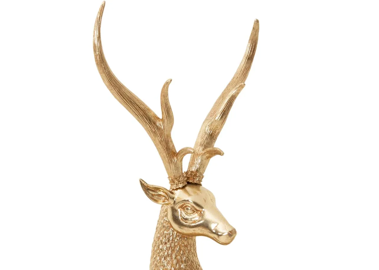 A lifestyle image of the Vermont snow tree with lying deer and Santa Nutcracker and Red Standing Deer.