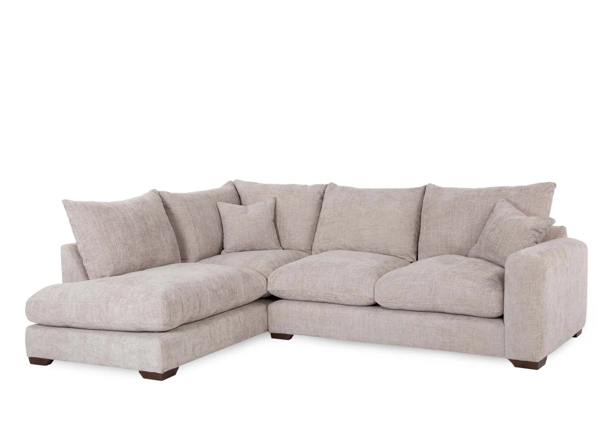 A beige fabric corner sofa with lhf lounger from EZ Livings Aurora range. Angled view of plump back cushions