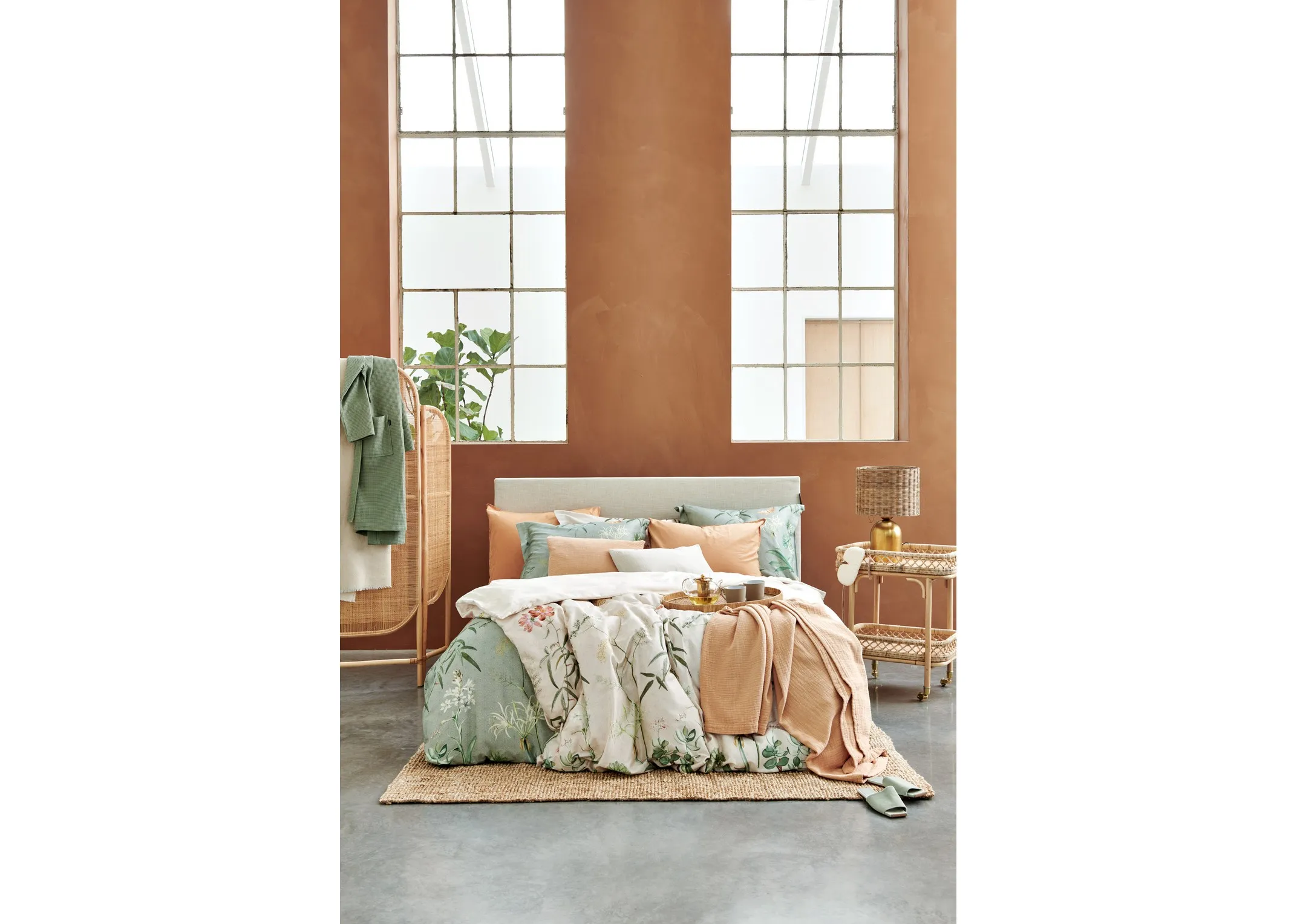 A lifestyle image of the Flower Garden & apricot duvet covers & bedspreads from Van Dyck