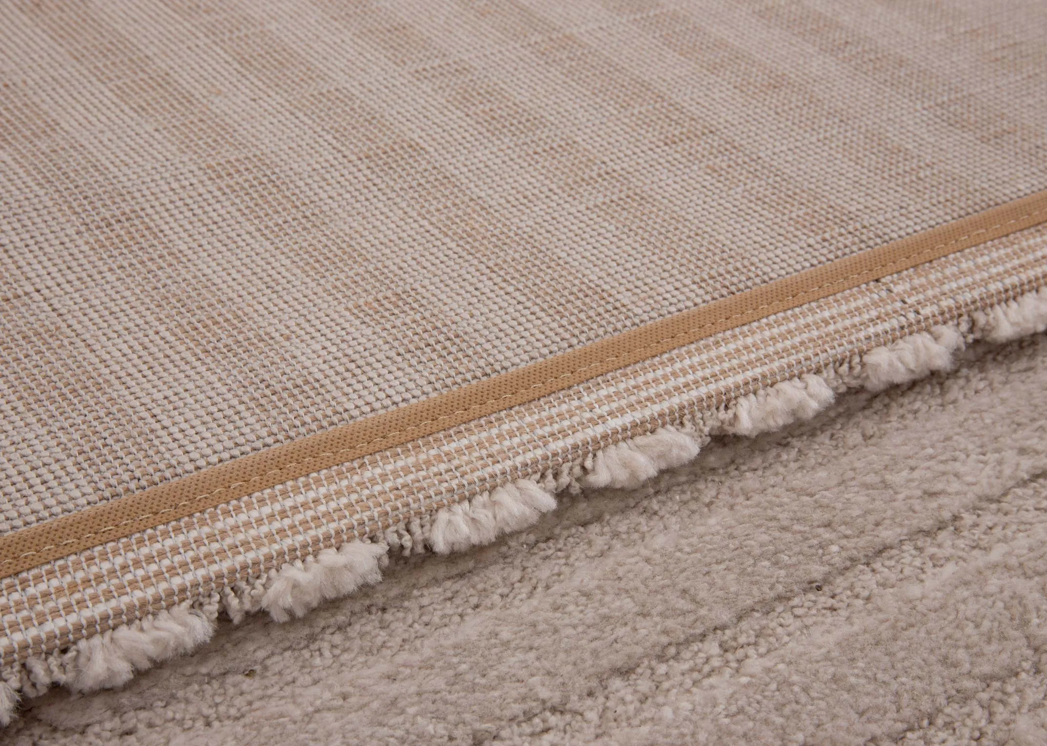 A beige & cream geometric design rug from EZ Livings Elio range.