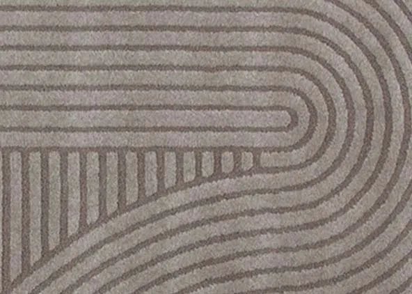 A grey geometric design rug from EZ Livings Eli range. Closeup of grey & brown design