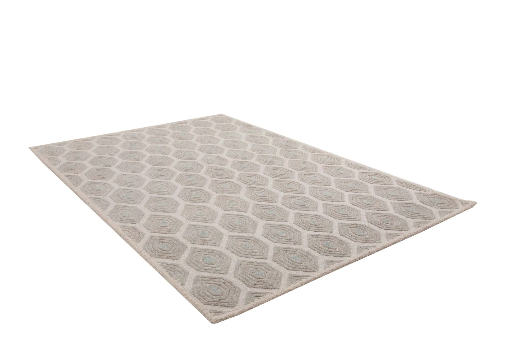 A beige honeycomb print rug from EZ Livings Elio range. Angled view