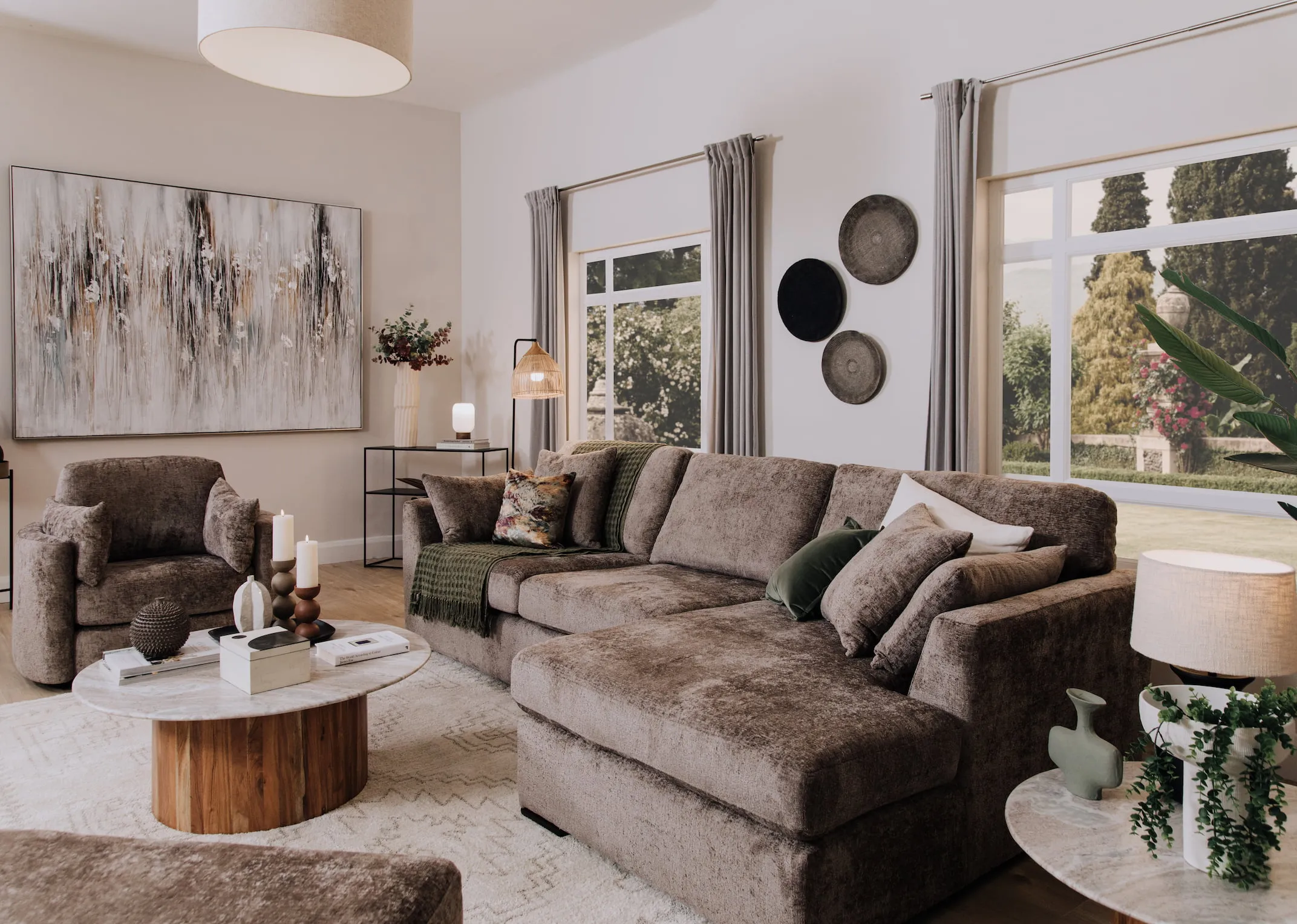 A lifestyle image of the Naples Corner sofa with Cauley side tables.